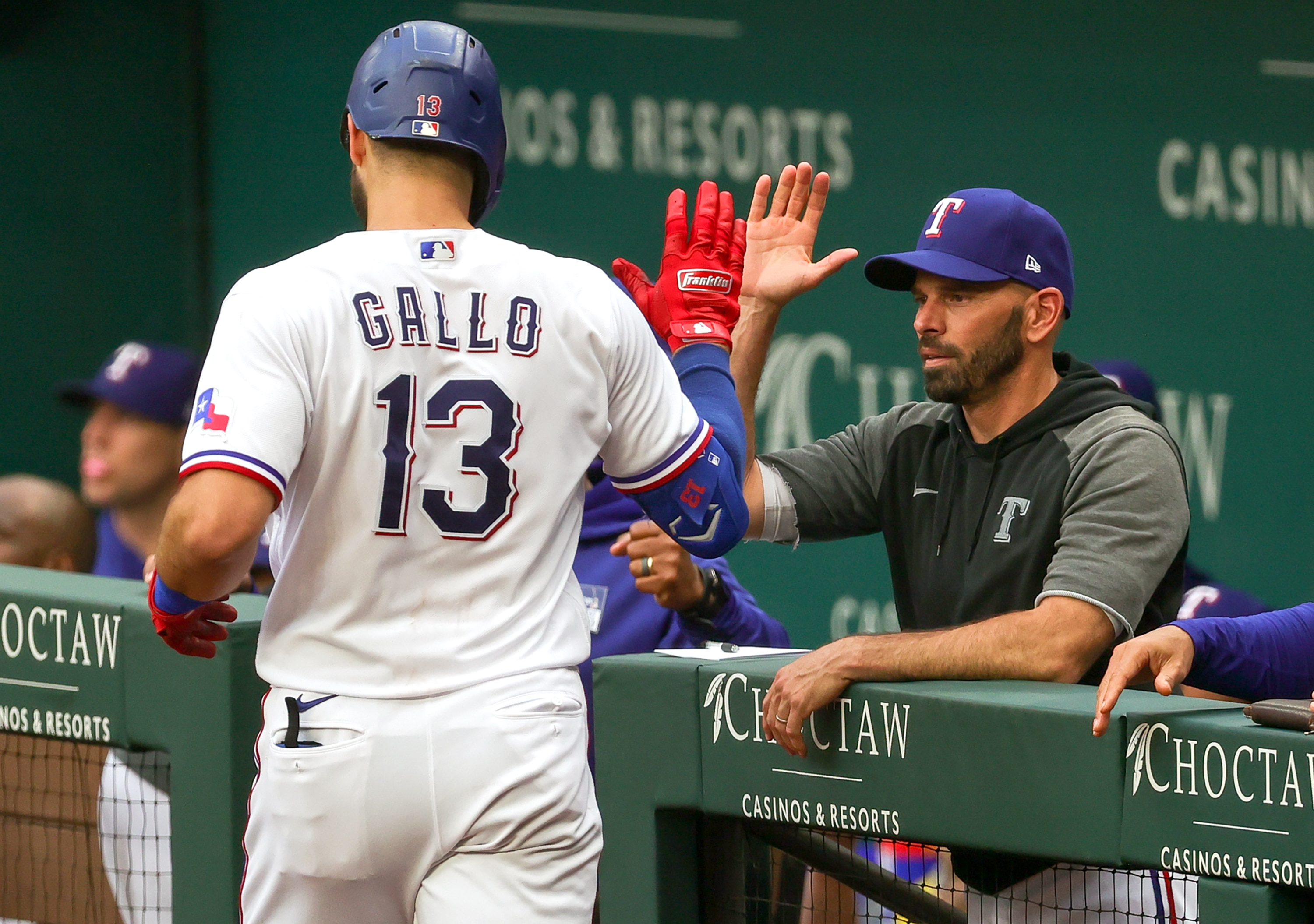 ARLINGTON, TX - JUNE 08: Texas Rangers right fielder Joey Gallo gets congratulated by Texas Rangers manager Chris Woodward after hitting a home run during the game between the San Francisco Giants and the Texas Rangers on June 8, 2021 at Globe Life Field in Arlington,Texas. (Photo by Steve Nurenberg/Icon Sportswire via Getty Images)
