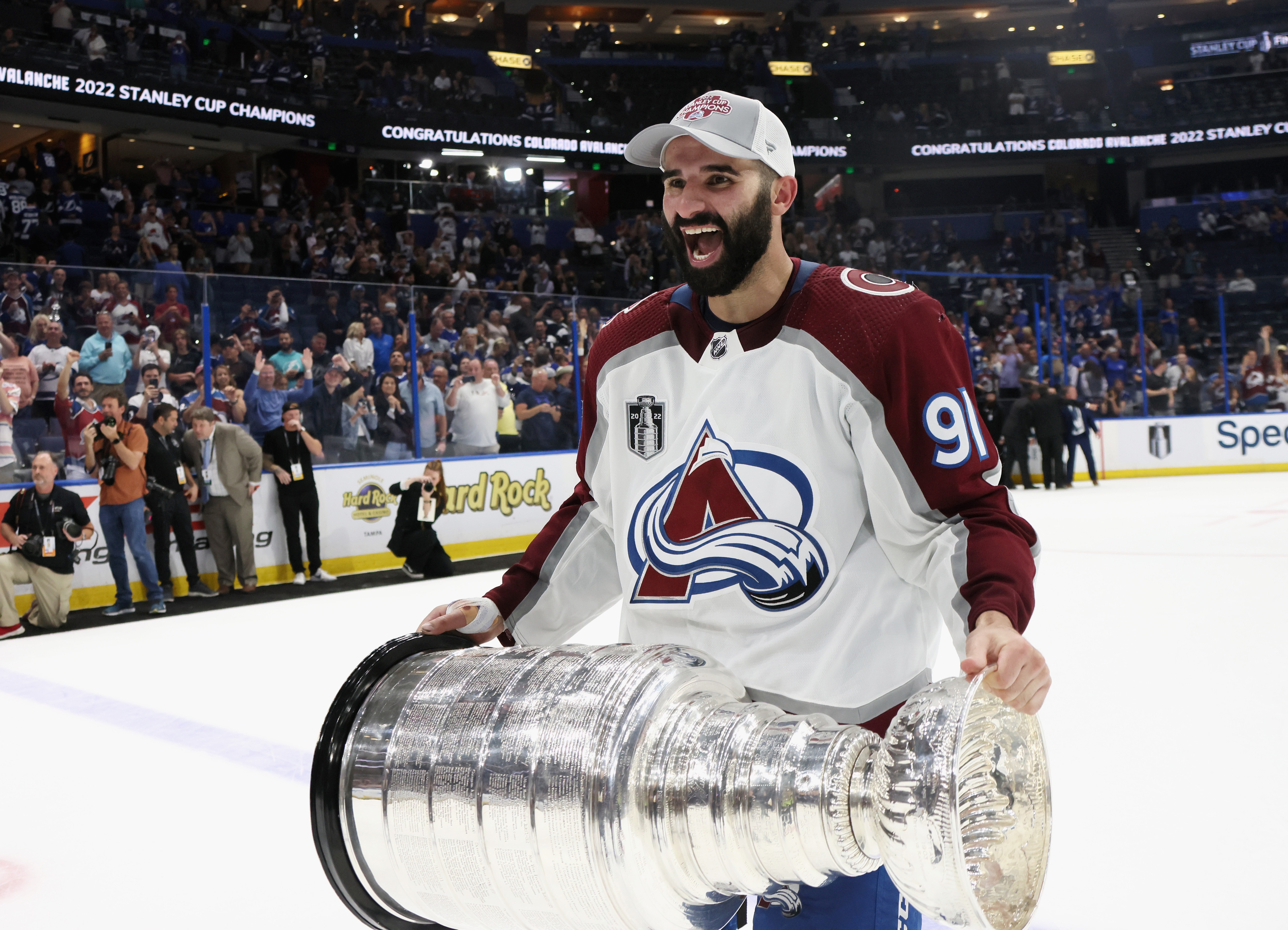 TAMPA, FLORIDA - JUNE 26: Nazem Kadri #91 of the Colorado Avalanche carries the Stanley Cup following the series winning victory over the Tampa Bay Lightning in Game Six of the 2022 NHL Stanley Cup Final at Amalie Arena on June 26, 2022 in Tampa, Florida. (Photo by Bruce Bennett/Getty Images)