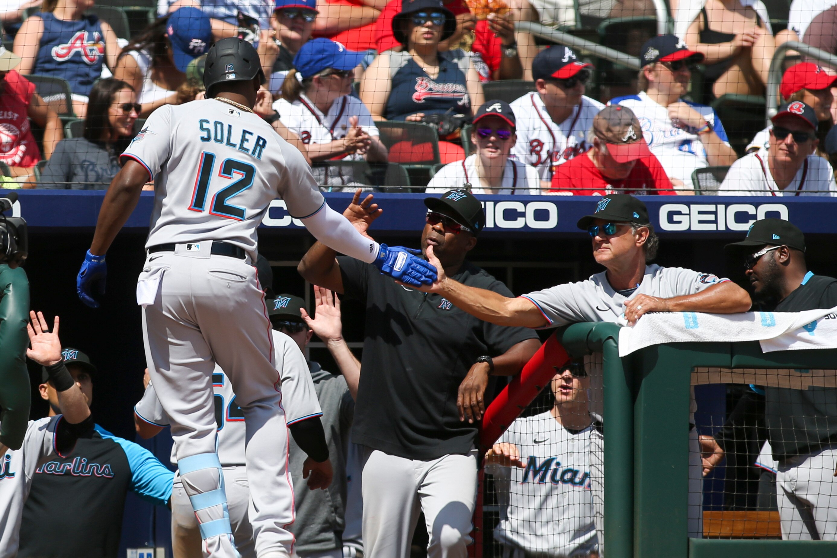 ATLANTA, GA - MAY 29: Jorge Soler #12 of the Miami Marlins celebrates his two-run home run with manager Don Mattingly #8 against the Atlanta Braves in the seventh inning at Truist Park on May 29, 2022 in Atlanta, Georgia. (Photo by Brett Davis/Getty Images)