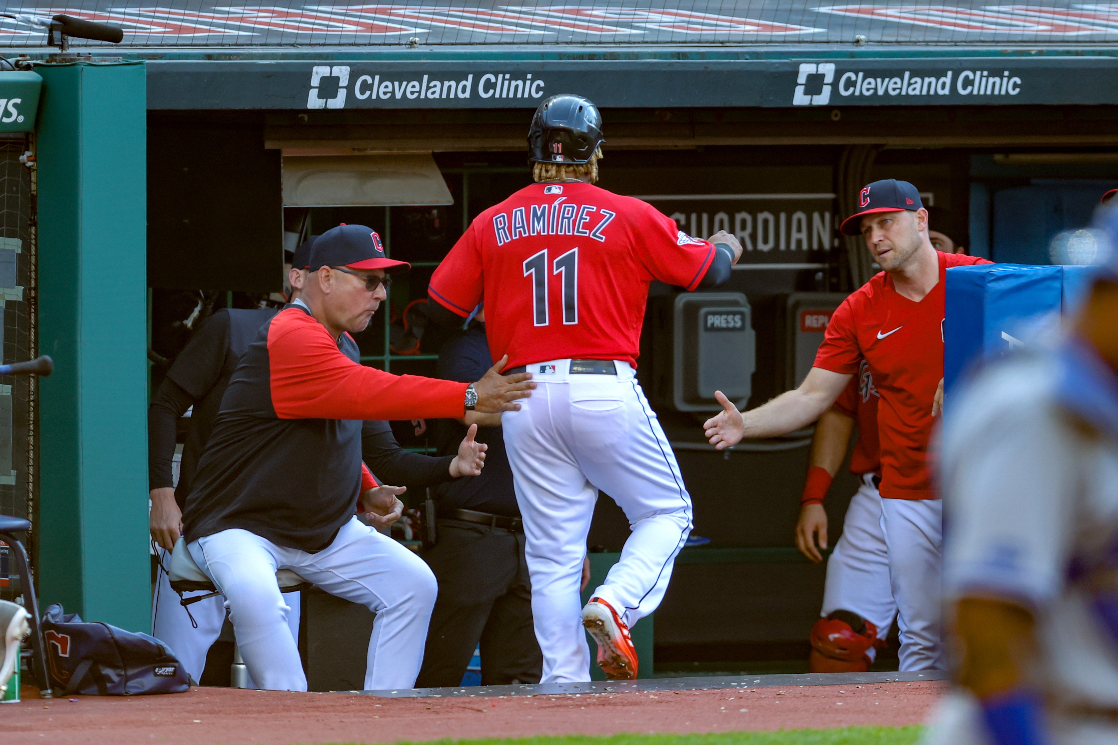 CLEVELAND, OH - MAY 31: Cleveland Guardians designated hitter Jose Ramirez (11) gets a pat on the back from Cleveland Guardians manager Terry Francona (77) after scoring a run during the first inning of the Major League Baseball game between the Kansas City Royals and Cleveland Guardinas on May 31, 2022, at Progressive Field in Cleveland, OH.  (Photo by Frank Jansky/Icon Sportswire via Getty Images)