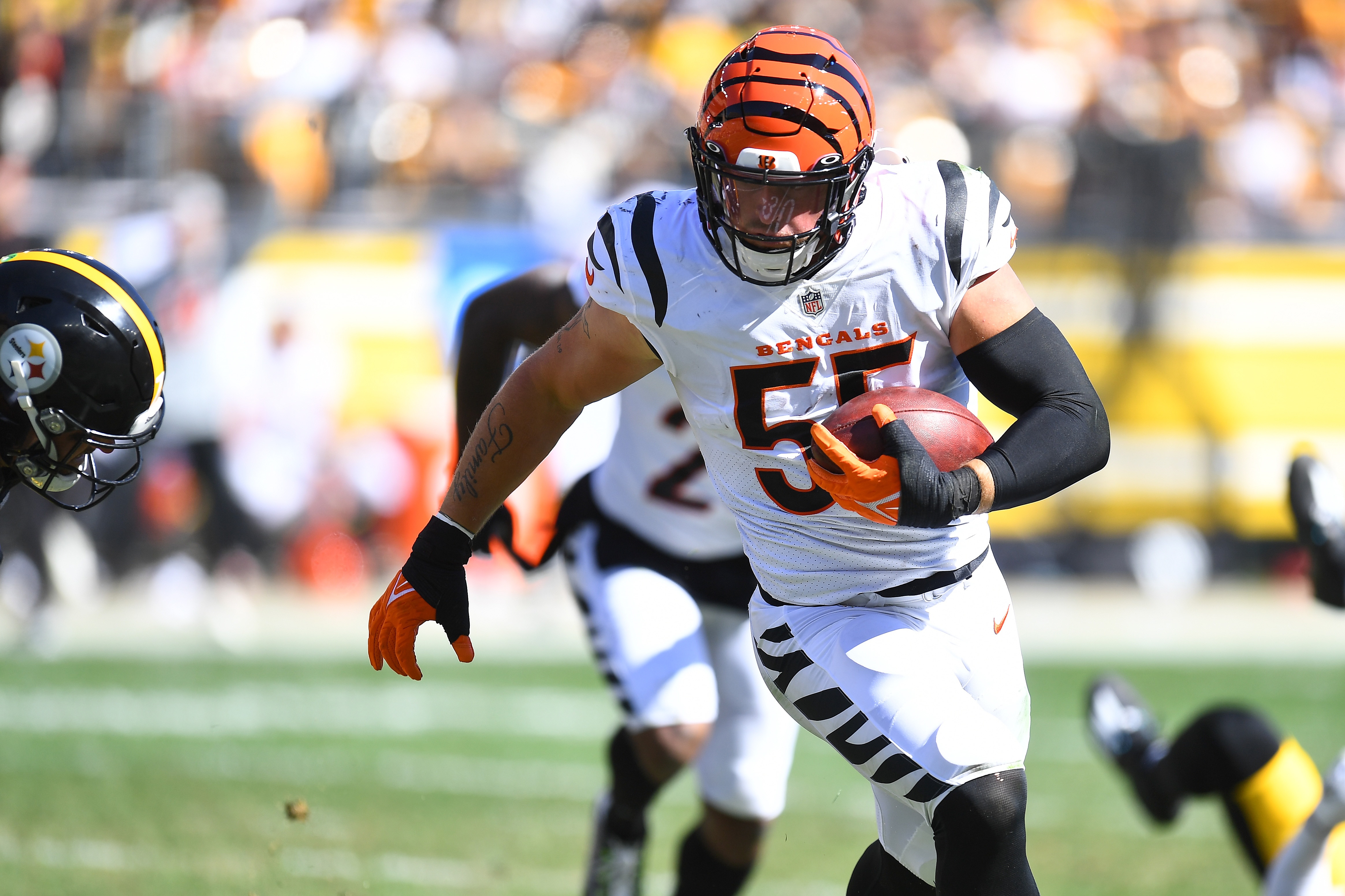 PITTSBURGH, PENNSYLVANIA - SEPTEMBER 26: Logan Wilson #55 of the Cincinnati Bengals runs the ball after an interception during the third quarter in the game against the Pittsburgh Steelers at Heinz Field on September 26, 2021 in Pittsburgh, Pennsylvania. (Photo by Joe Sargent/Getty Images)