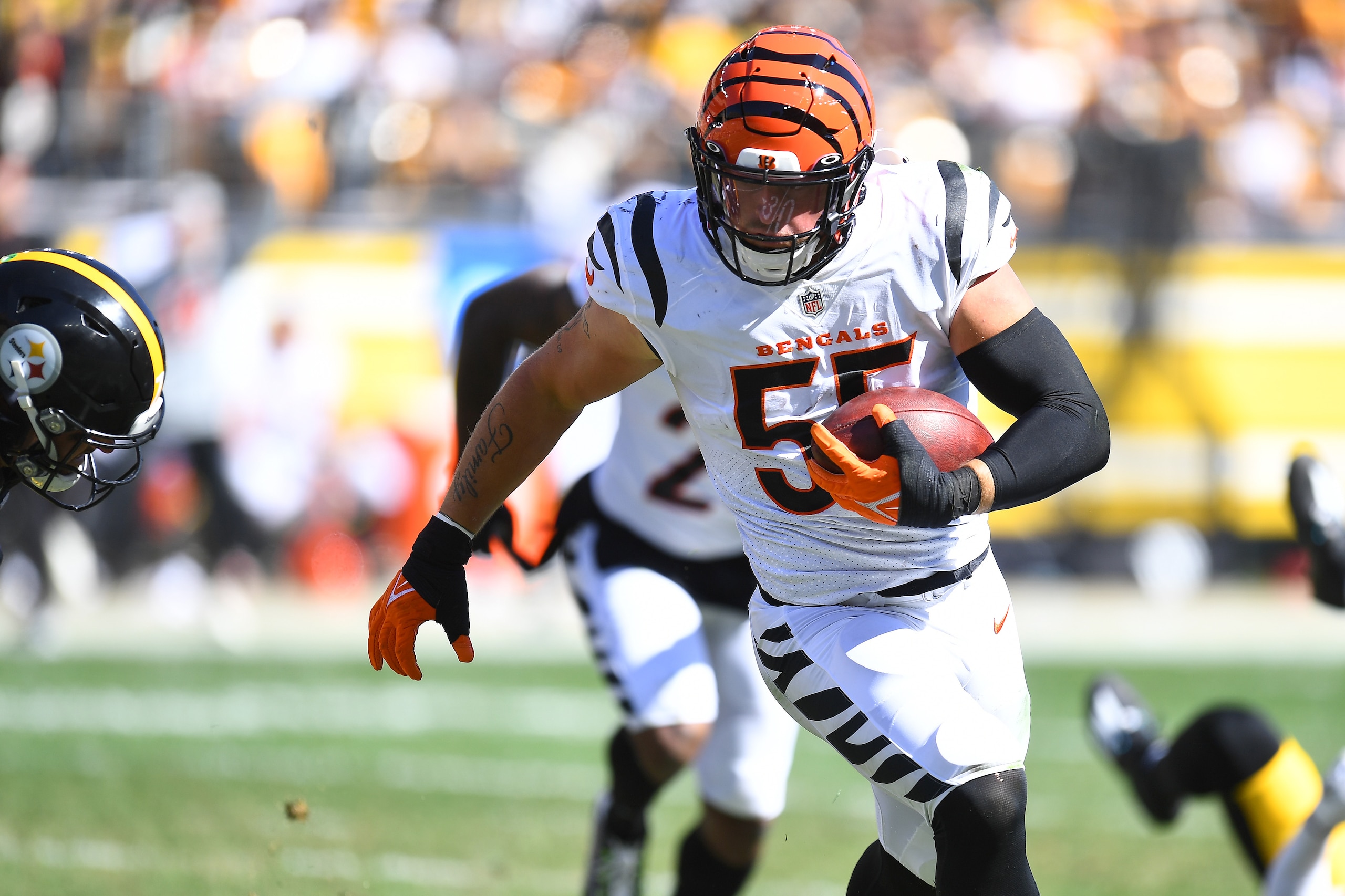PITTSBURGH, PENNSYLVANIA - SEPTEMBER 26: Logan Wilson #55 of the Cincinnati Bengals runs the ball after an interception during the third quarter in the game against the Pittsburgh Steelers at Heinz Field on September 26, 2021 in Pittsburgh, Pennsylvania. (Photo by Joe Sargent/Getty Images) PITTSBURGH, PENNSYLVANIA - SEPTEMBER 26: Logan Wilson #55 of the Cincinnati Bengals runs the ball after an interception during the third quarter in the game against the Pittsburgh Steelers at Heinz Field on September 26, 2021 in Pittsburgh, Pennsylvania. (Photo by Joe Sargent/Getty Images)