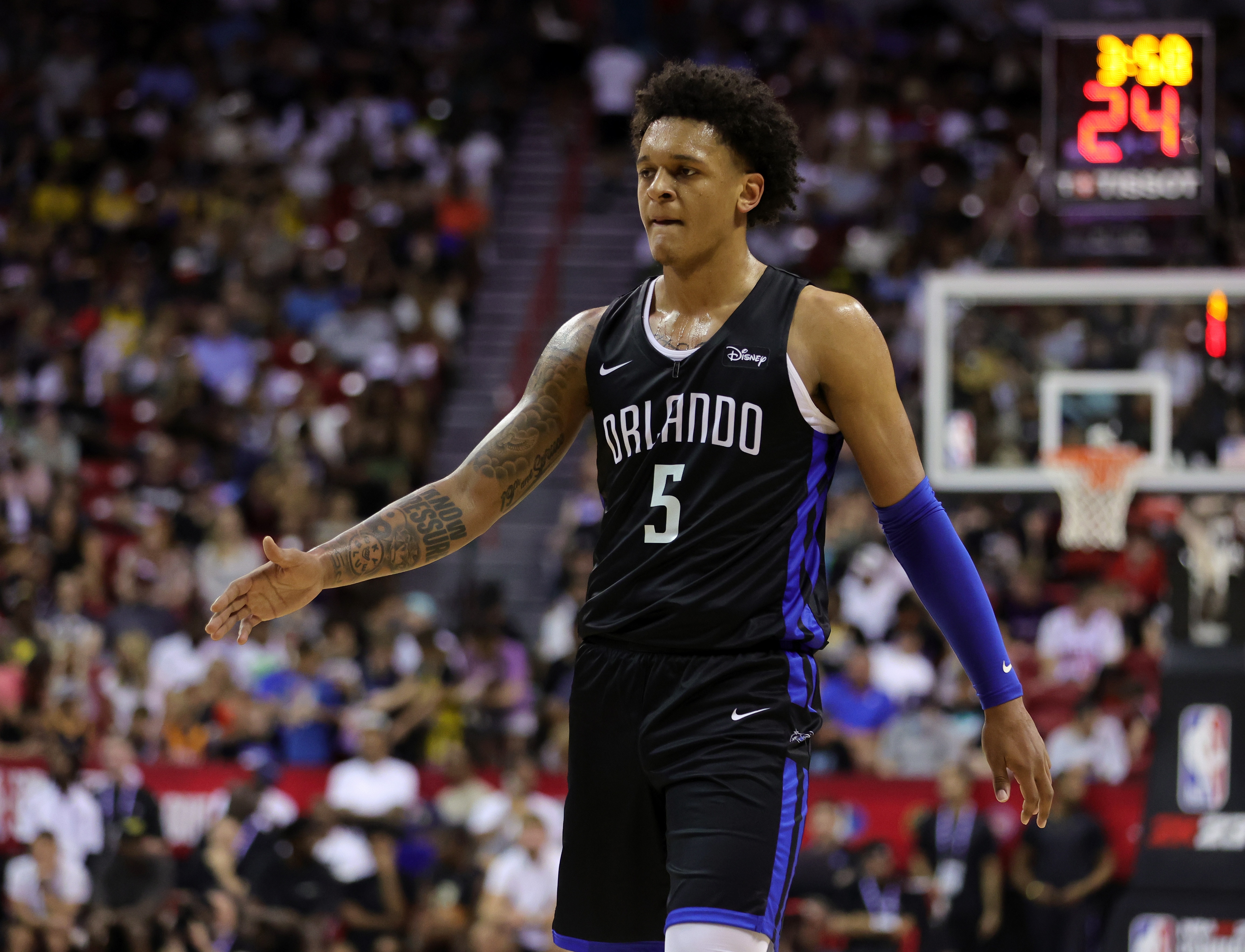 LAS VEGAS, NEVADA - JULY 09: Paolo Banchero #5 of the Orlando Magic goes to high-five a teammate after a play against the Sacramento Kings during the 2022 NBA Summer League at the Thomas & Mack Center on July 09, 2022 in Las Vegas, Nevada. NOTE TO USER: User expressly acknowledges and agrees that, by downloading and or using this photograph, User is consenting to the terms and conditions of the Getty Images License Agreement. (Photo by Ethan Miller/Getty Images)