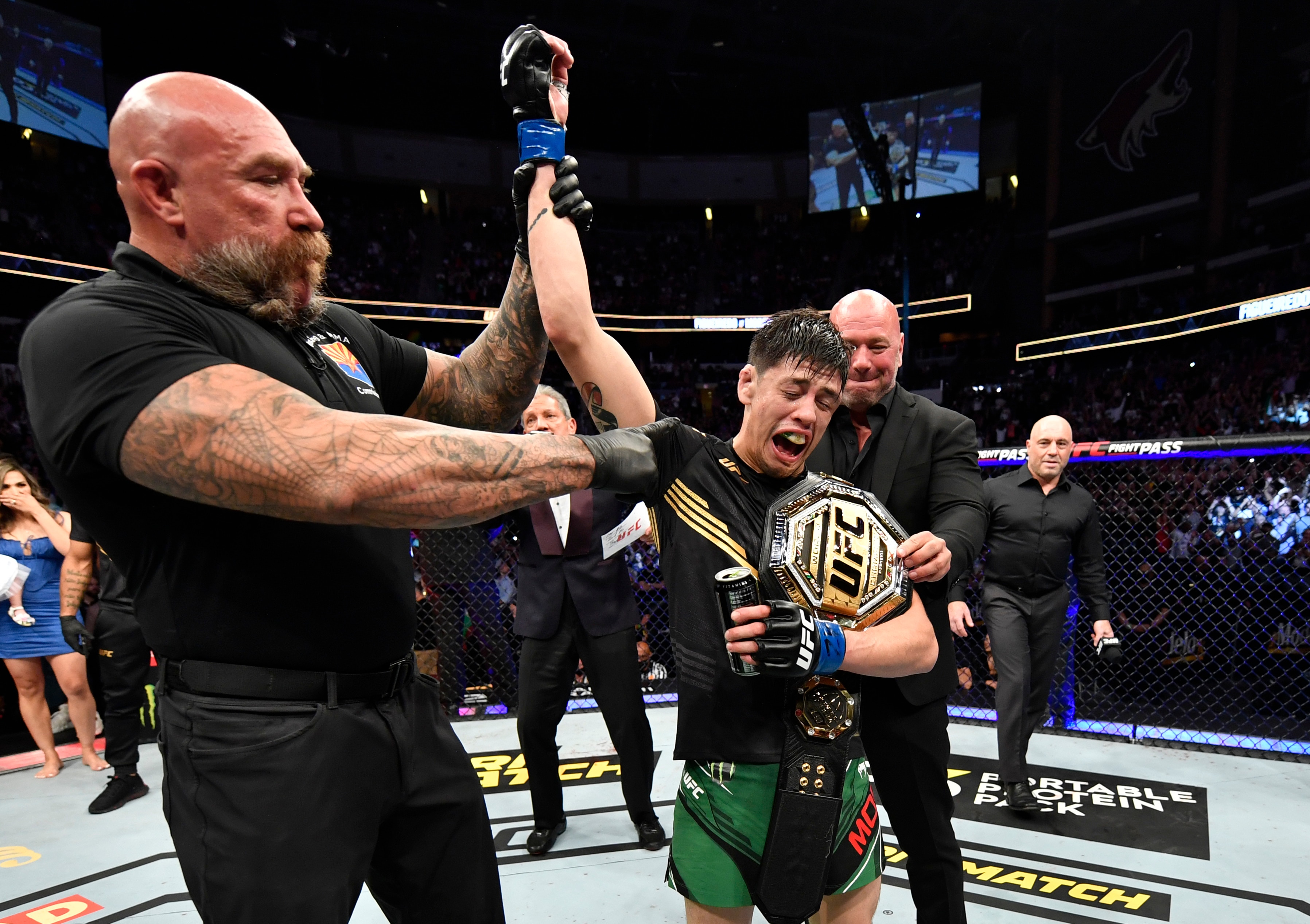 GLENDALE, ARIZONA - JUNE 12: Brandon Moreno of Mexico reacts after submitting Deiveson Figueiredo of Brazil to win the UFC flyweight championship fight during the UFC 263 event at Gila River Arena on June 12, 2021 in Glendale, Arizona. (Photo by Jeff Bottari/Zuffa LLC)