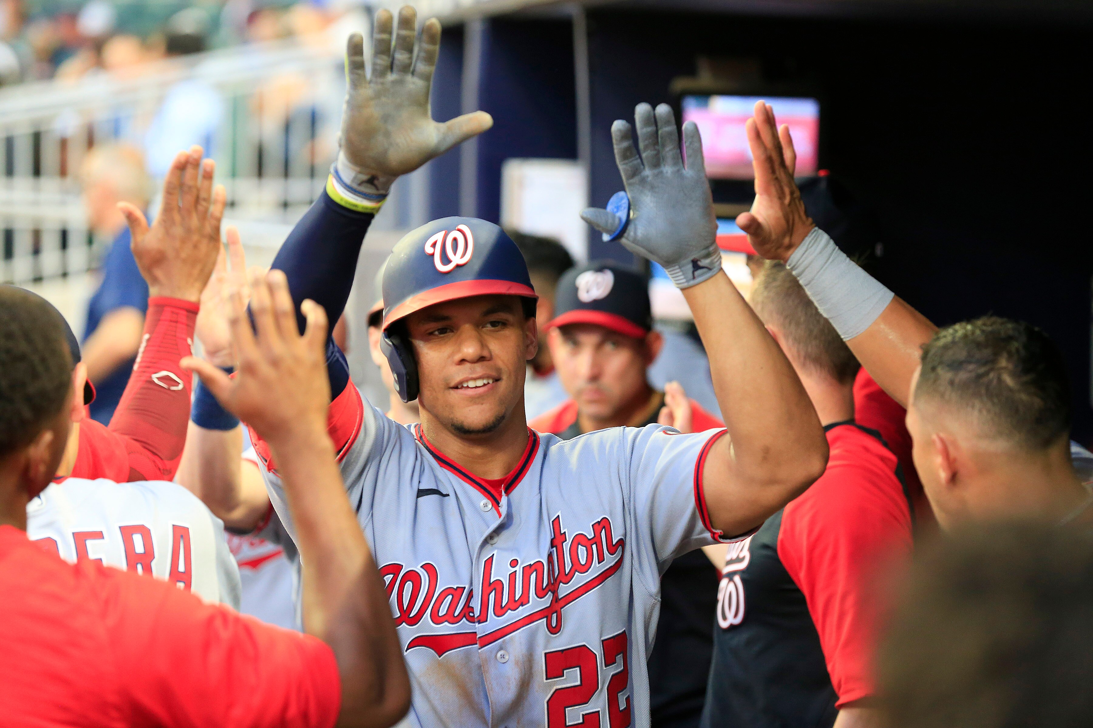 ATLANTA, GA - JULY 08: Washington Nationals right fielder Juan Soto (22) celebrates his 2 run home run with his fellow teammates during the Friday evening MLB game between the Washiungton Nationals and the Atlanta Braves on July 8, 2022 at Truist Park in Atlanta, Georgia. (Photo by David J. Griffin/Icon Sportswire via Getty Images) ATLANTA, GA - JULY 08: Washington Nationals right fielder Juan Soto (22) celebrates his 2 run home run with his fellow teammates during the Friday evening MLB game between the Washiungton Nationals and the Atlanta Braves on July 8, 2022 at Truist Park in Atlanta, Georgia. (Photo by David J. Griffin/Icon Sportswire via Getty Images)