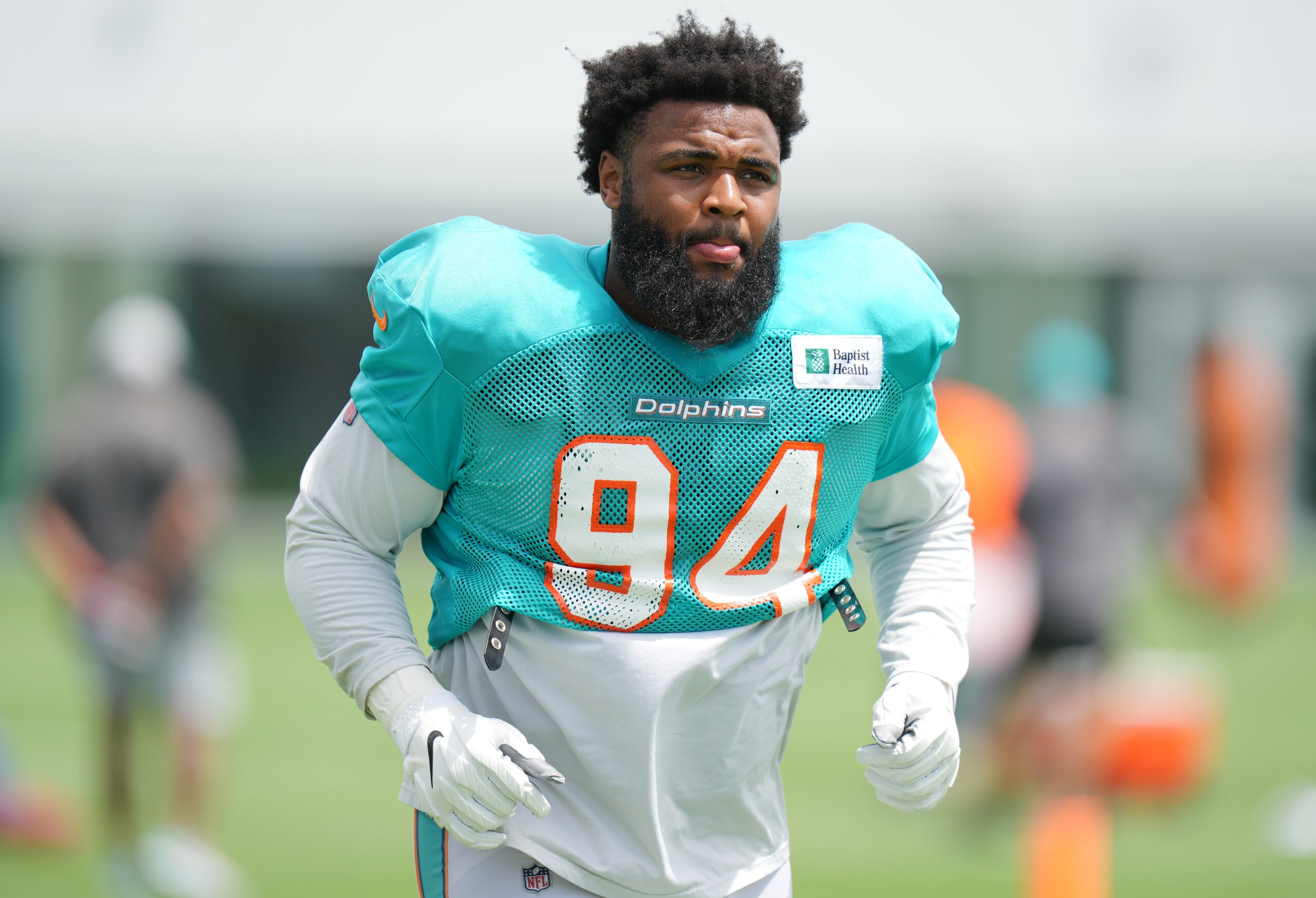MIAMI GARDENS, FLORIDA - AUGUST 25: Defensive Tackle Christian Wilkins #94 of the Miami Dolphins looks on during Training Camp at Baptist Health Training Complex on August 25, 2021 in Miami Gardens, Florida. (Photo by Mark Brown/Getty Images) MIAMI GARDENS, FLORIDA - AUGUST 25: Defensive Tackle Christian Wilkins #94 of the Miami Dolphins looks on during Training Camp at Baptist Health Training Complex on August 25, 2021 in Miami Gardens, Florida. (Photo by Mark Brown/Getty Images)
