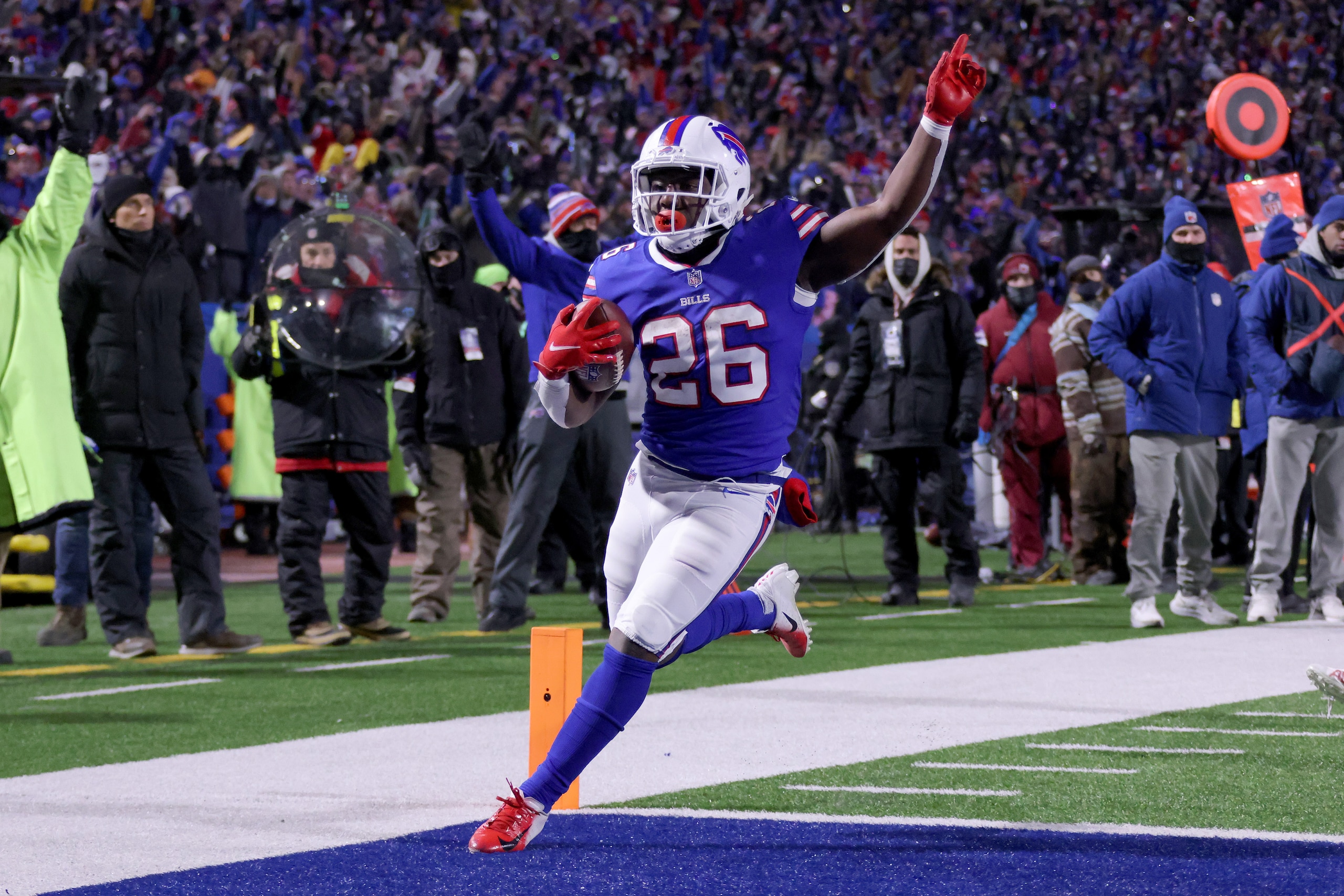 BUFFALO, NEW YORK - JANUARY 15: Devin Singletary #26 of the Buffalo Bills celebrate as he scores a touchdown against the New England Patriots during the second quarter in the AFC Wild Card playoff game at Highmark Stadium on January 15, 2022 in Buffalo, New York. (Photo by Timothy T Ludwig/Getty Images) BUFFALO, NEW YORK - JANUARY 15: Devin Singletary #26 of the Buffalo Bills celebrate as he scores a touchdown against the New England Patriots during the second quarter in the AFC Wild Card playoff game at Highmark Stadium on January 15, 2022 in Buffalo, New York. (Photo by Timothy T Ludwig/Getty Images)