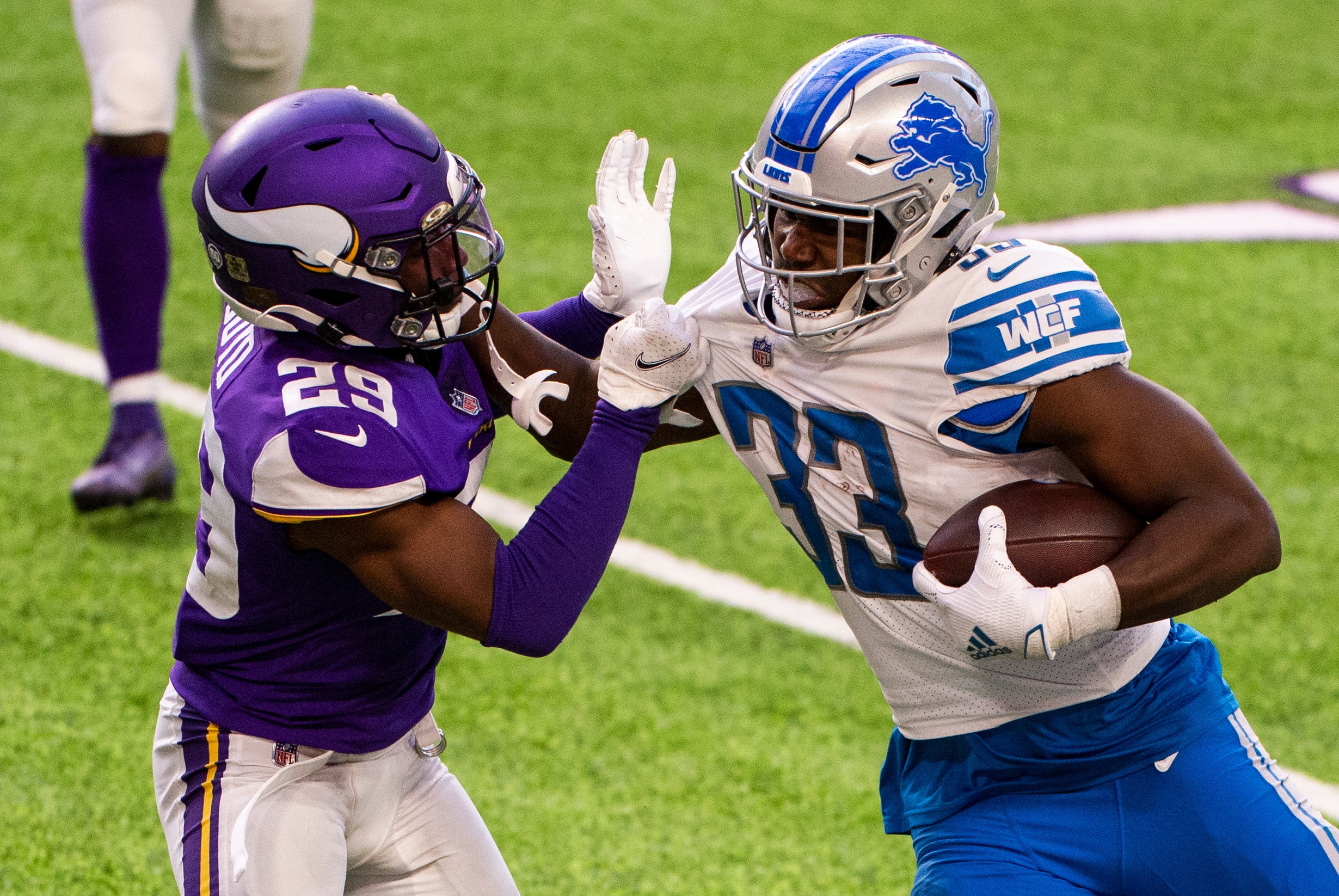 MINNEAPOLIS, MN - NOVEMBER 08: Kerryon Johnson #33 of the Detroit Lions is tackled by Kris Boyd #29 of the Minnesota Vikings in the fourth quarter of the game at U.S. Bank Stadium on November 8, 2020 in Minneapolis, Minnesota. (Photo by Stephen Maturen/Getty Images)