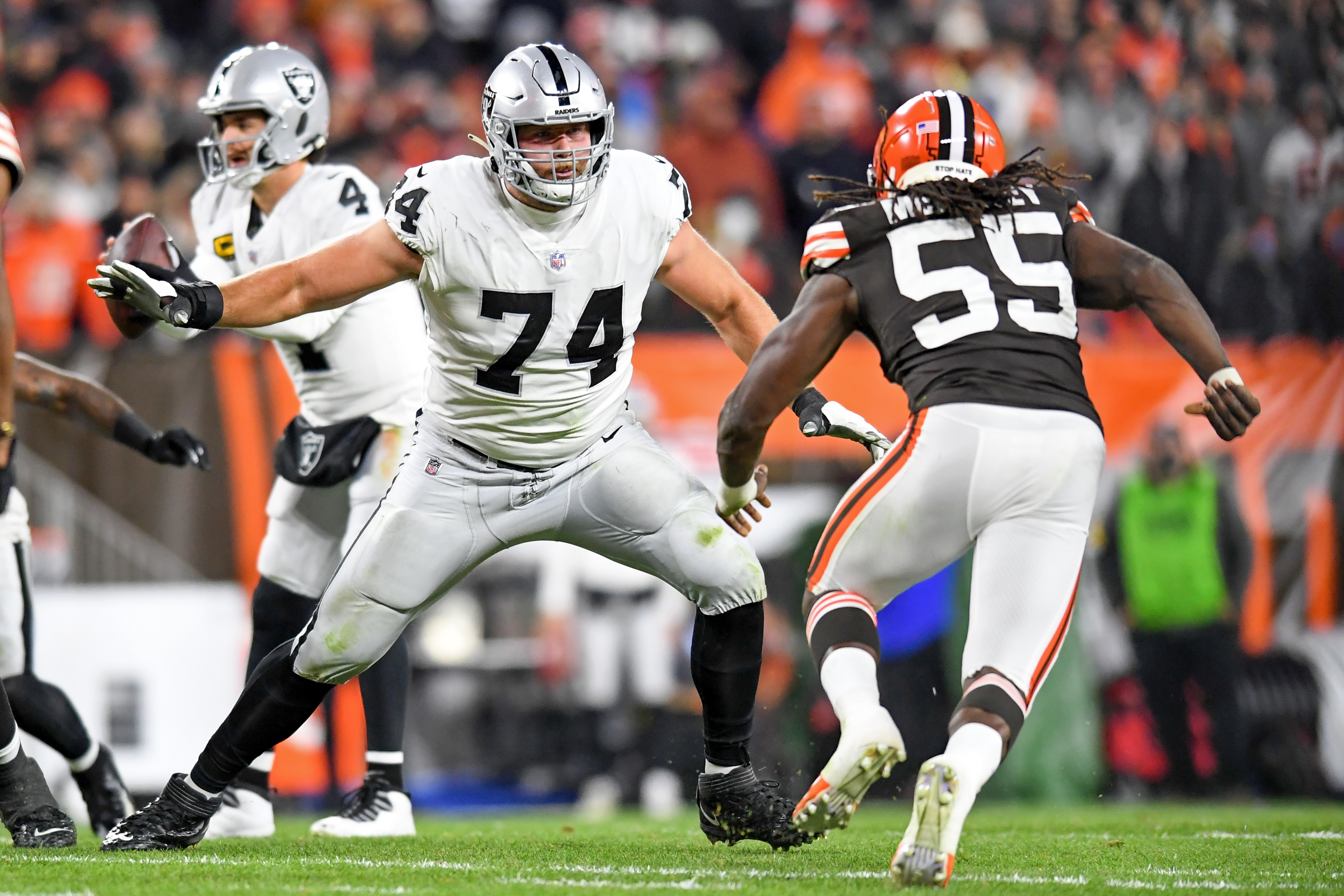 CLEVELAND, OH - DECEMBER 20: Kolton Miller #74 of the Las Vegas Raiders blocks Takkarist McKinley #55 of the Cleveland Browns during the first half at FirstEnergy Stadium in Cleveland, Ohio. (Photo by Nick Cammett/Diamond Images via Getty Images)