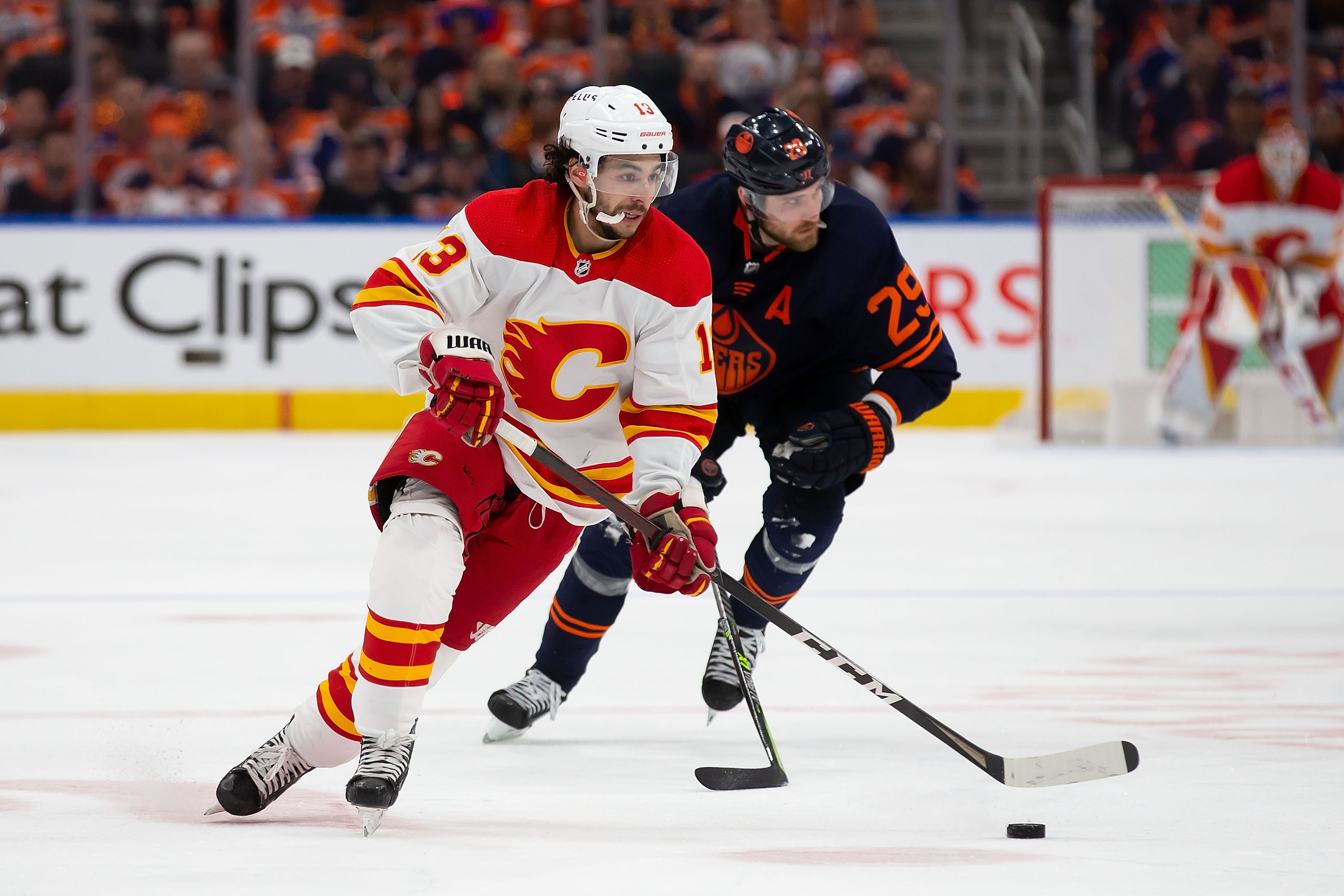 EDMONTON, AB - MAY 24: Johnny Gaudreau #13 of the Calgary Flames skates in against Leon Draisaitl #29 of the Edmonton Oilers during the third period in Game Four of the Second Round of the 2022 Stanley Cup Playoffs at Rogers Place on May 24, 2022 in Edmonton, Canada. (Photo by Codie McLachlan/Getty Images)