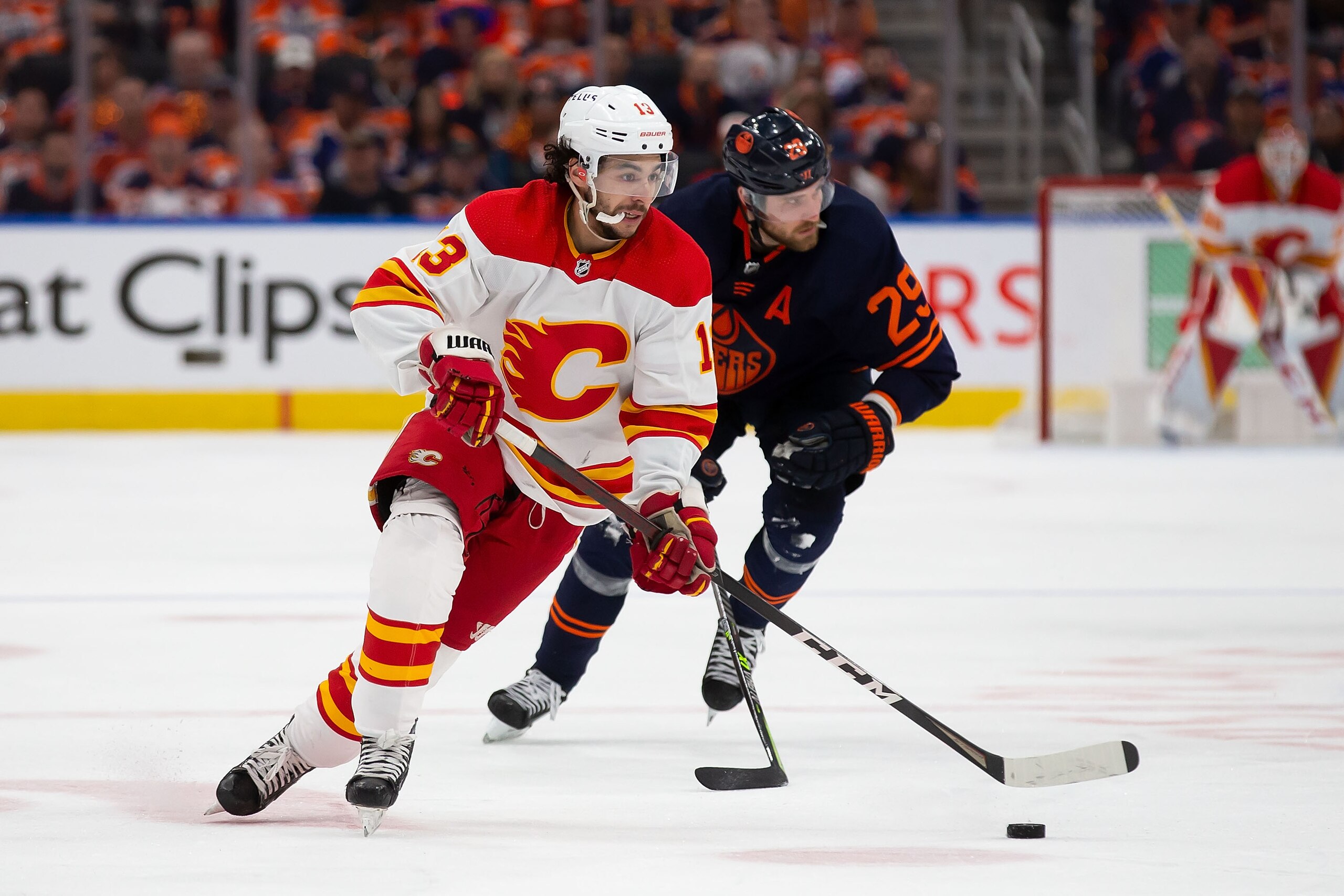 EDMONTON, AB - MAY 24: Johnny Gaudreau #13 of the Calgary Flames skates in against Leon Draisaitl #29 of the Edmonton Oilers during the third period in Game Four of the Second Round of the 2022 Stanley Cup Playoffs at Rogers Place on May 24, 2022 in Edmonton, Canada. (Photo by Codie McLachlan/Getty Images)