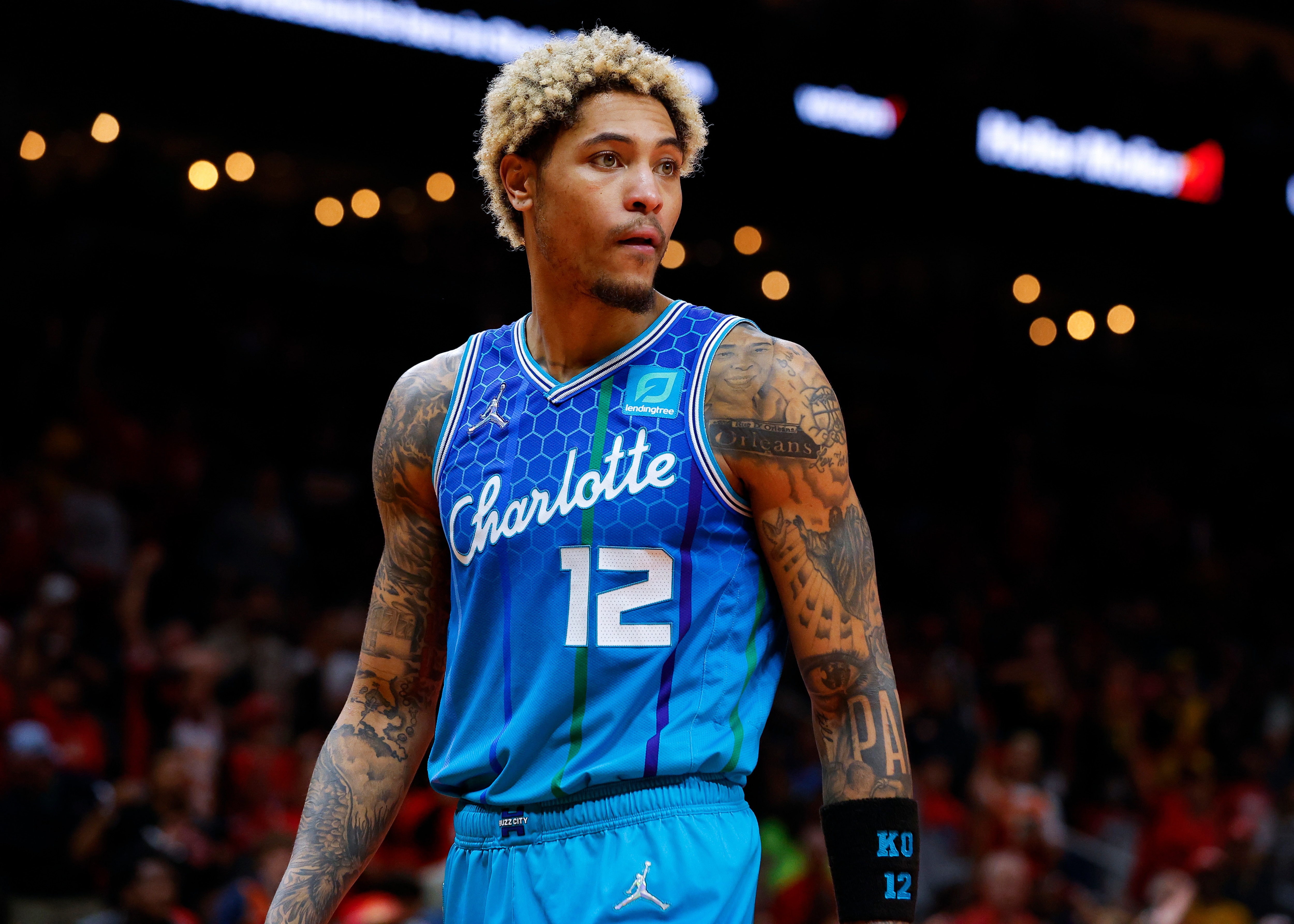 ATLANTA, GA - APRIL 13: Kelly Oubre Jr. #12 of the Charlotte Hornets reacts during a break in play during the second half against the Atlanta Hawks at State Farm Arena on April 13, 2022 in Atlanta, Georgia. NOTE TO USER: User expressly acknowledges and agrees that, by downloading and or using this photograph, User is consenting to the terms and conditions of the Getty Images License Agreement. (Photo by Todd Kirkland/Getty Images)