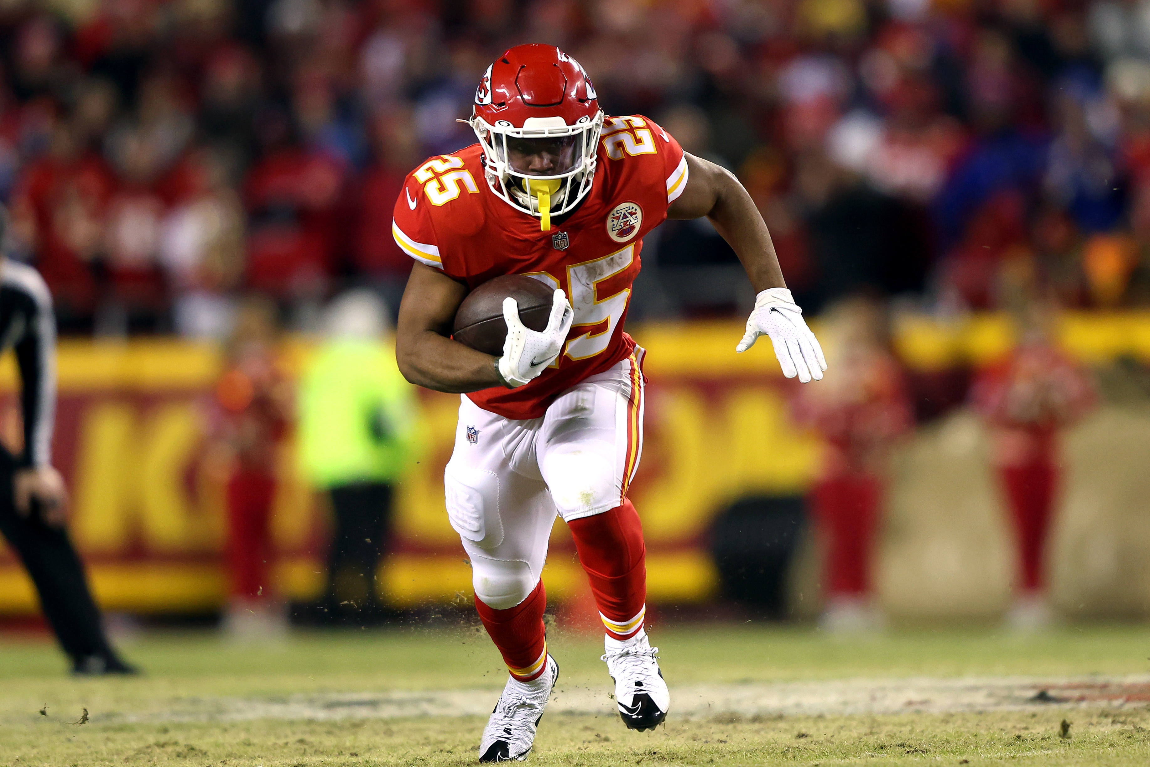 KANSAS CITY, MISSOURI - JANUARY 23: Clyde Edwards-Helaire #25 of the Kansas City Chiefs runs with the ball during the game against the Buffalo Bills in the AFC Divisional Playoff game at Arrowhead Stadium on January 23, 2022 in Kansas City, Missouri. (Photo by Jamie Squire/Getty Images)