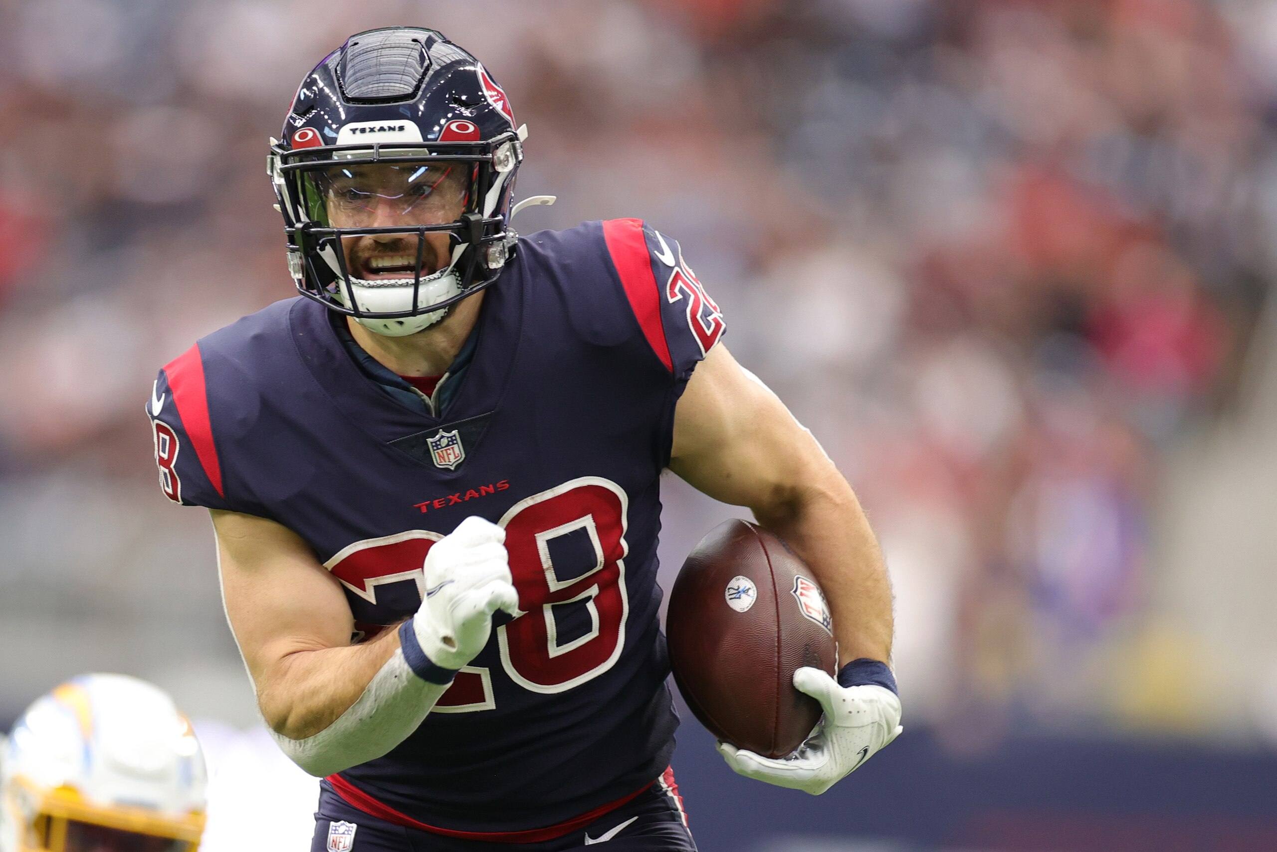 HOUSTON, TEXAS - DECEMBER 26: Rex Burkhead #28 of the Houston Texans in action against the Los Angeles Chargers at NRG Stadium on December 26, 2021 in Houston, Texas. (Photo by Carmen Mandato/Getty Images)