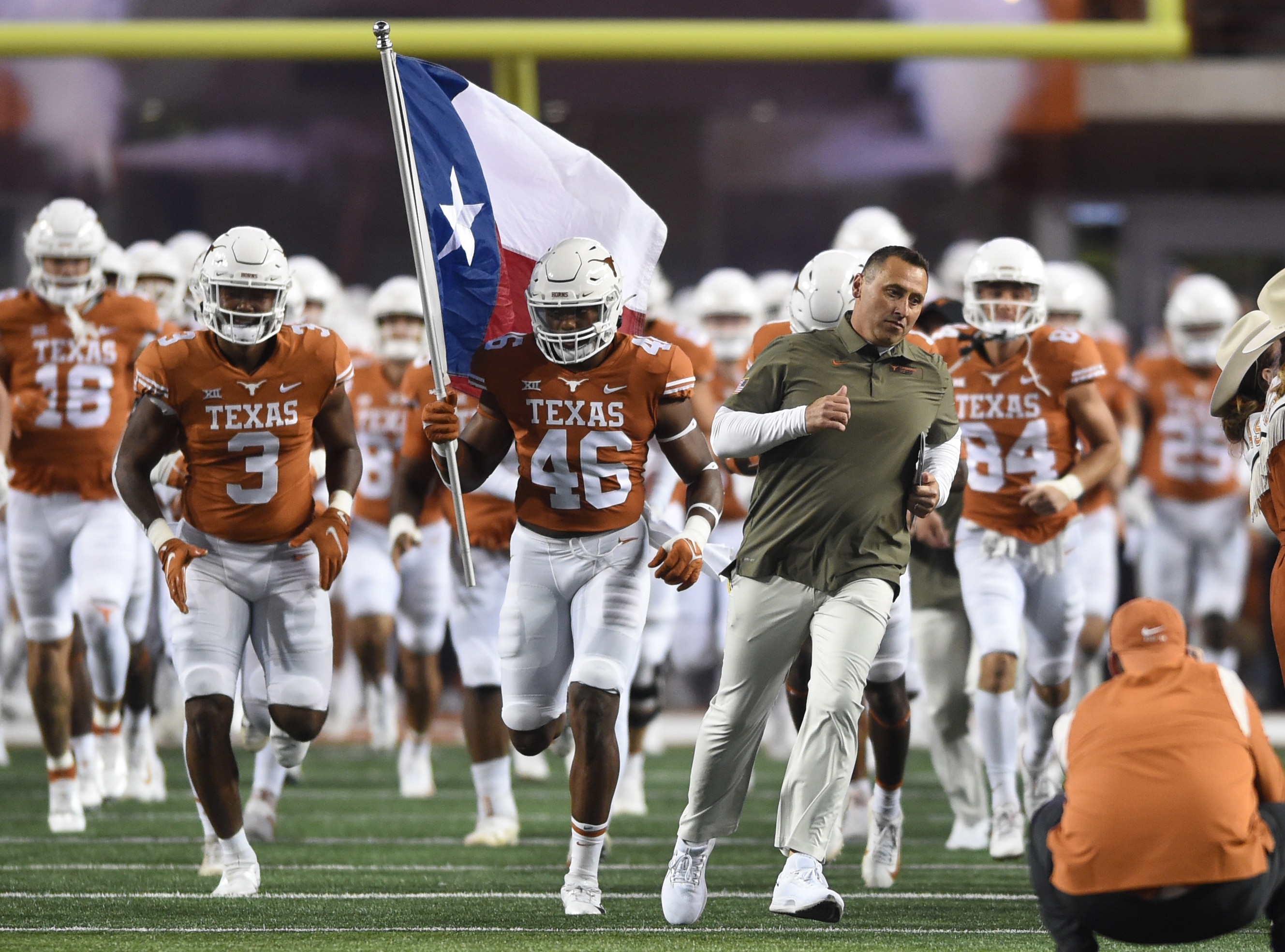 AUSTIN, TX - NOVEMBER 13: Texas Longhorns head coach Steve Sarkisian leads the team onto the field prior to start of game between the Kansas Jayhawks and the Texas Longhorns on November 13, 2021 at Darrell K Royal-Texas Memorial Stadium in Austin, TX.  (Photo by John Rivera/Icon Sportswire via Getty Images)