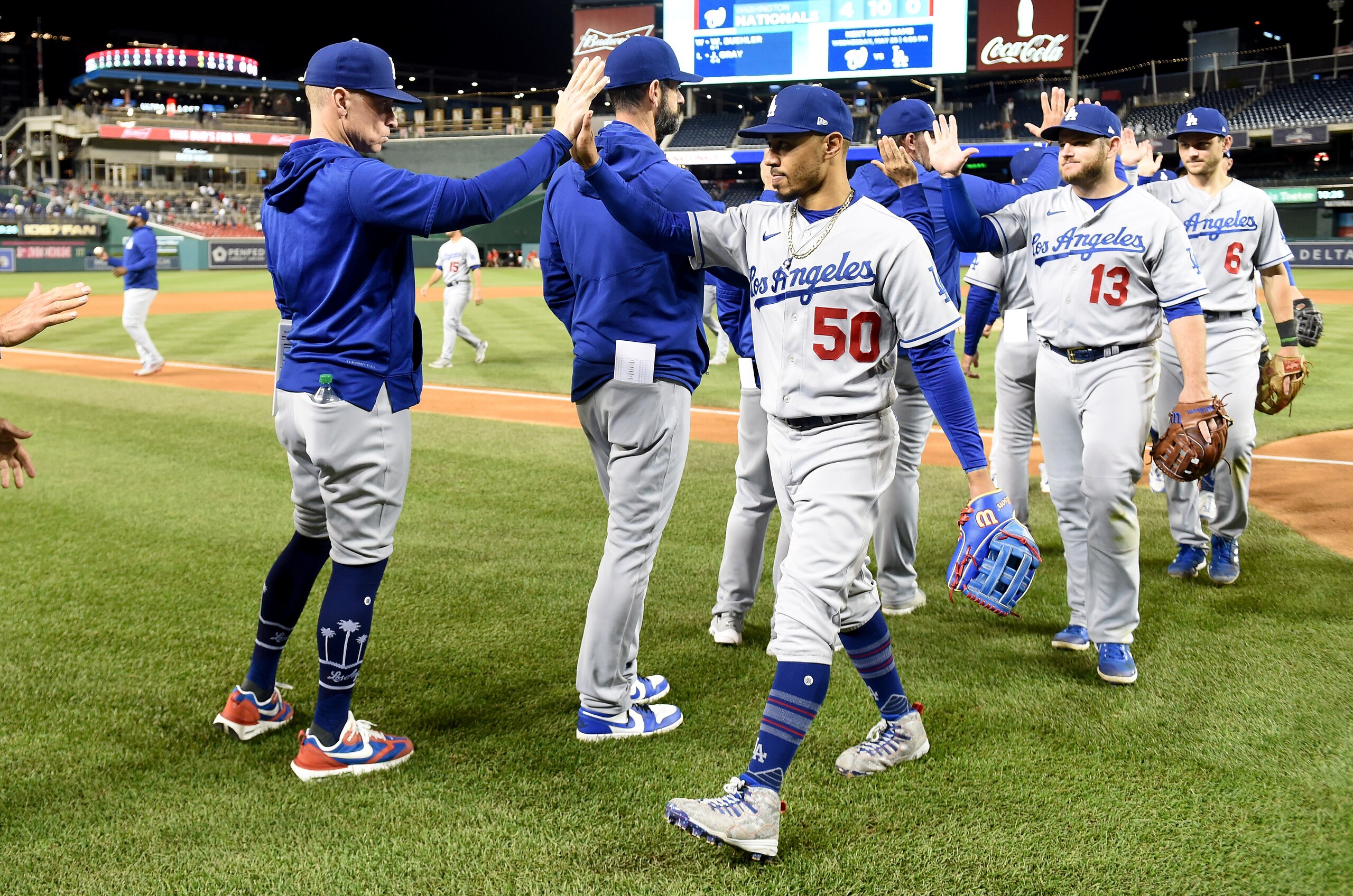 WASHINGTON, DC - MAY 24: Mookie Betts #50 of the Los Angeles Dodgers celebrates with teammates after a 9-4 victory against the Washington Nationals at Nationals Park on May 24, 2022 in Washington, DC. (Photo by Greg Fiume/Getty Images)