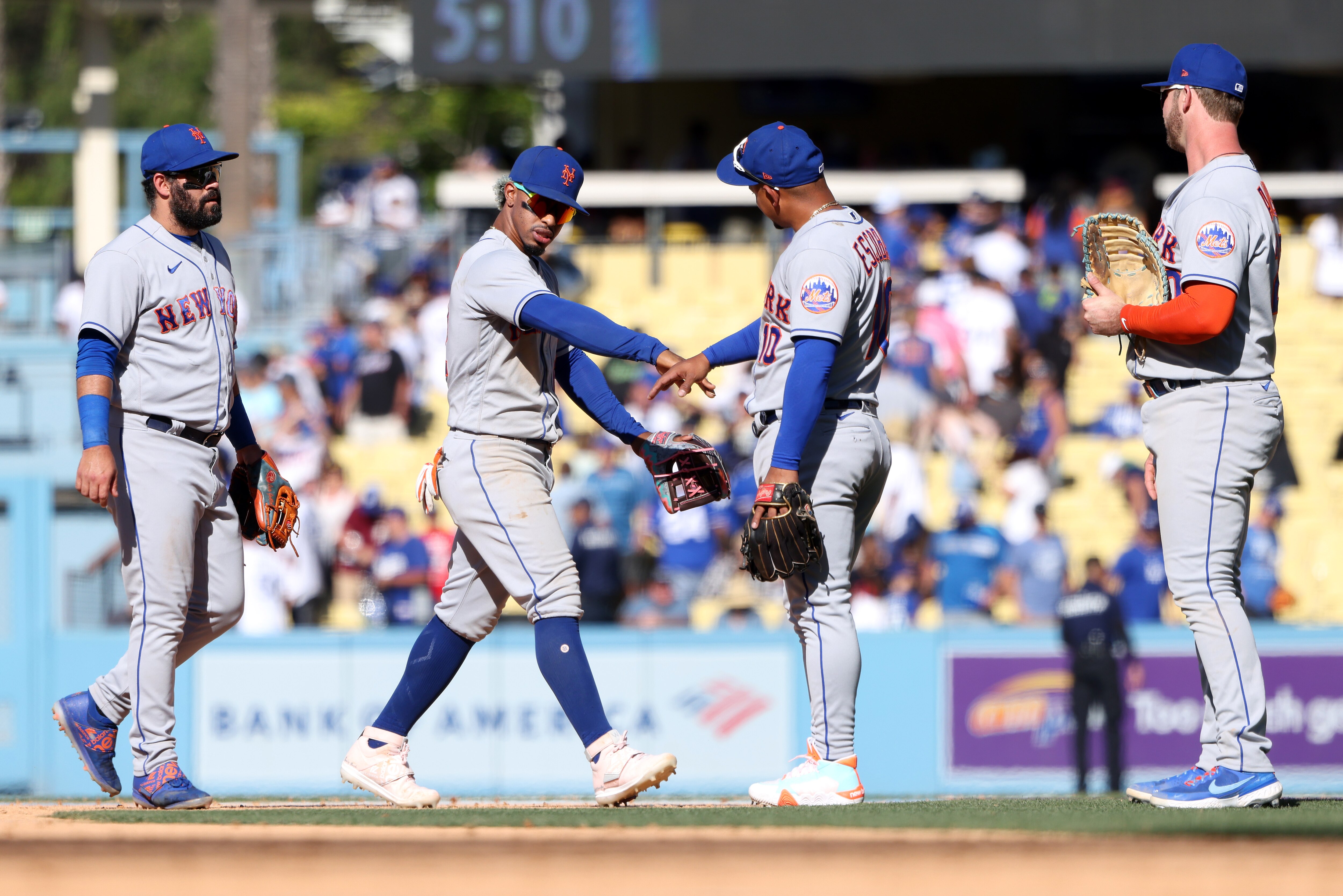 LOS ANGELES, CALIFORNIA - JUNE 05: Luis Guillorme #13, Francisco Lindor #12, Eduardo Escobar #10 and Pete Alonso #20 of the New York Mets celebrate their 5-4 win against the Los Angeles Dodgers after the game at Dodger Stadium on June 05, 2022 in Los Angeles, California. (Photo by Katelyn Mulcahy/Getty Images) LOS ANGELES, CALIFORNIA - JUNE 05: Luis Guillorme #13, Francisco Lindor #12, Eduardo Escobar #10 and Pete Alonso #20 of the New York Mets celebrate their 5-4 win against the Los Angeles Dodgers after the game at Dodger Stadium on June 05, 2022 in Los Angeles, California. (Photo by Katelyn Mulcahy/Getty Images)
