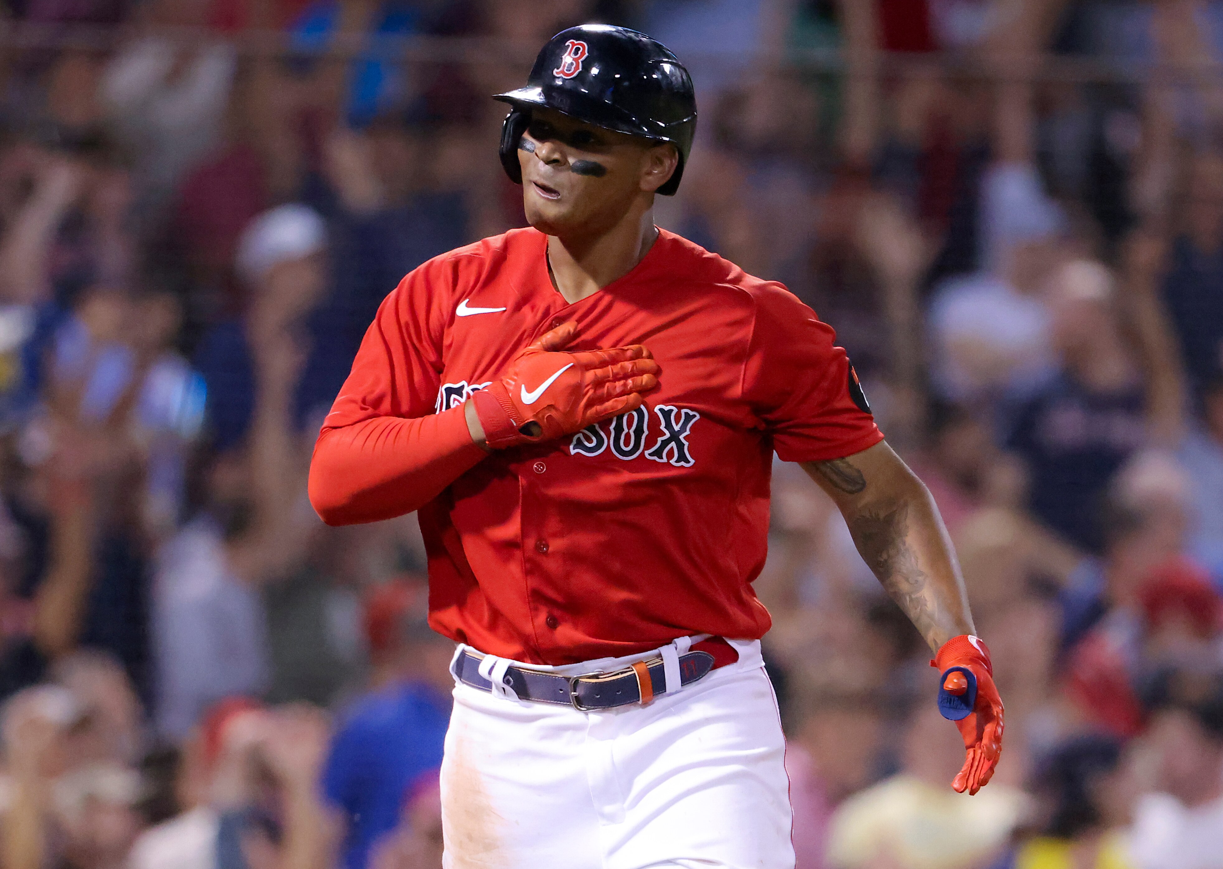 Boston, MA - July 6: Boston Red Sox Rafael Devers pounds his chest looking into his dugout after hitting a three run home run against the New York Yankees during fifth inning MLB action at Fenway Park. (Photo by Matthew J. Lee/The Boston Globe via Getty Images)