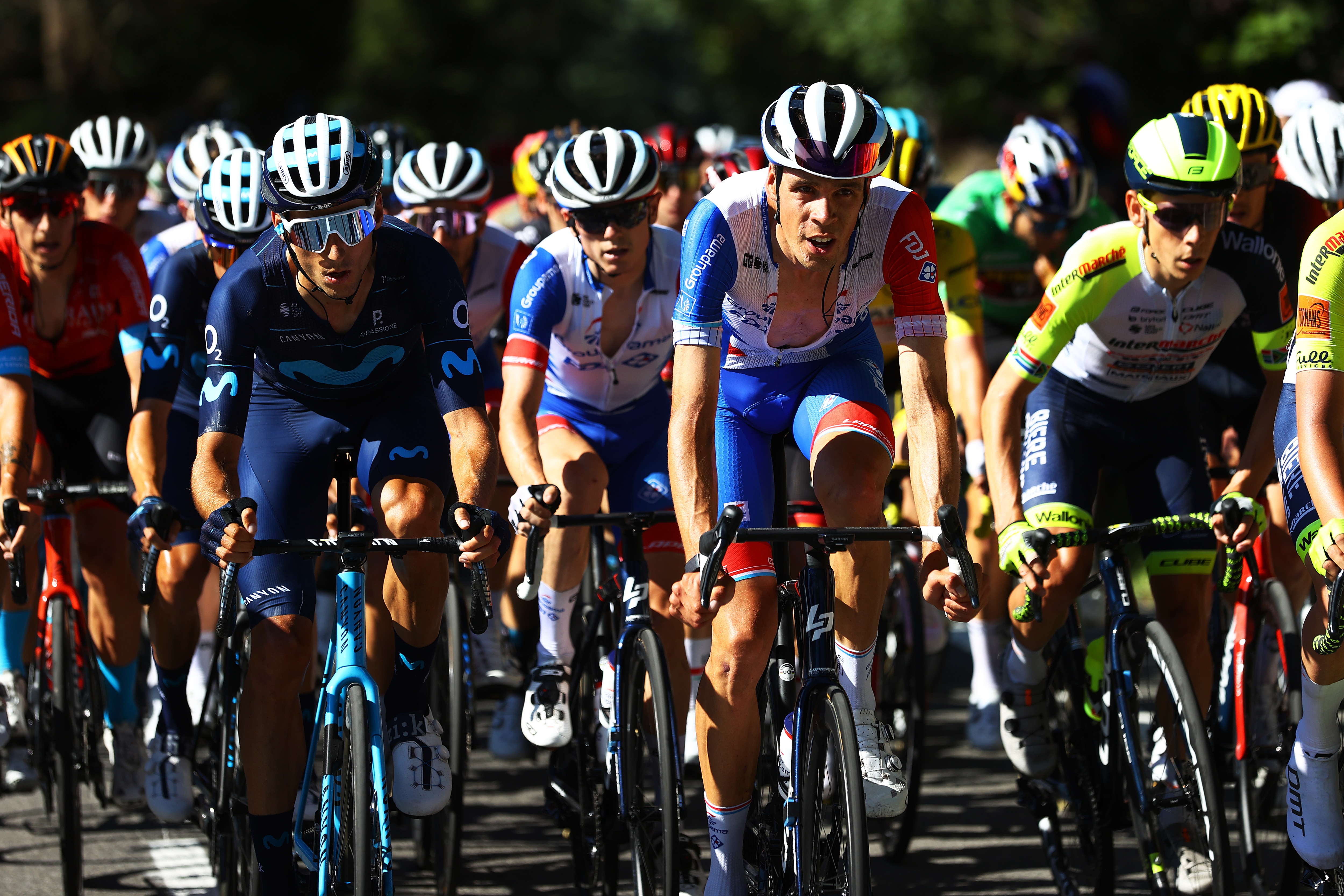 MEGEVE, FRANCE - JULY 12: (L-R) Carlos Verona Quintanilla of Spain and Movistar Team and Kevin Geniets of Luxembourg and Team Groupama - FDJ compete during the 109th Tour de France 2022, Stage 10 a 148,1km stage from Morzine to Megève 1435m / #TDF2022 / #WorldTour / on July 12, 2022 in Megeve, France. (Photo by Michael Steele/Getty Images)