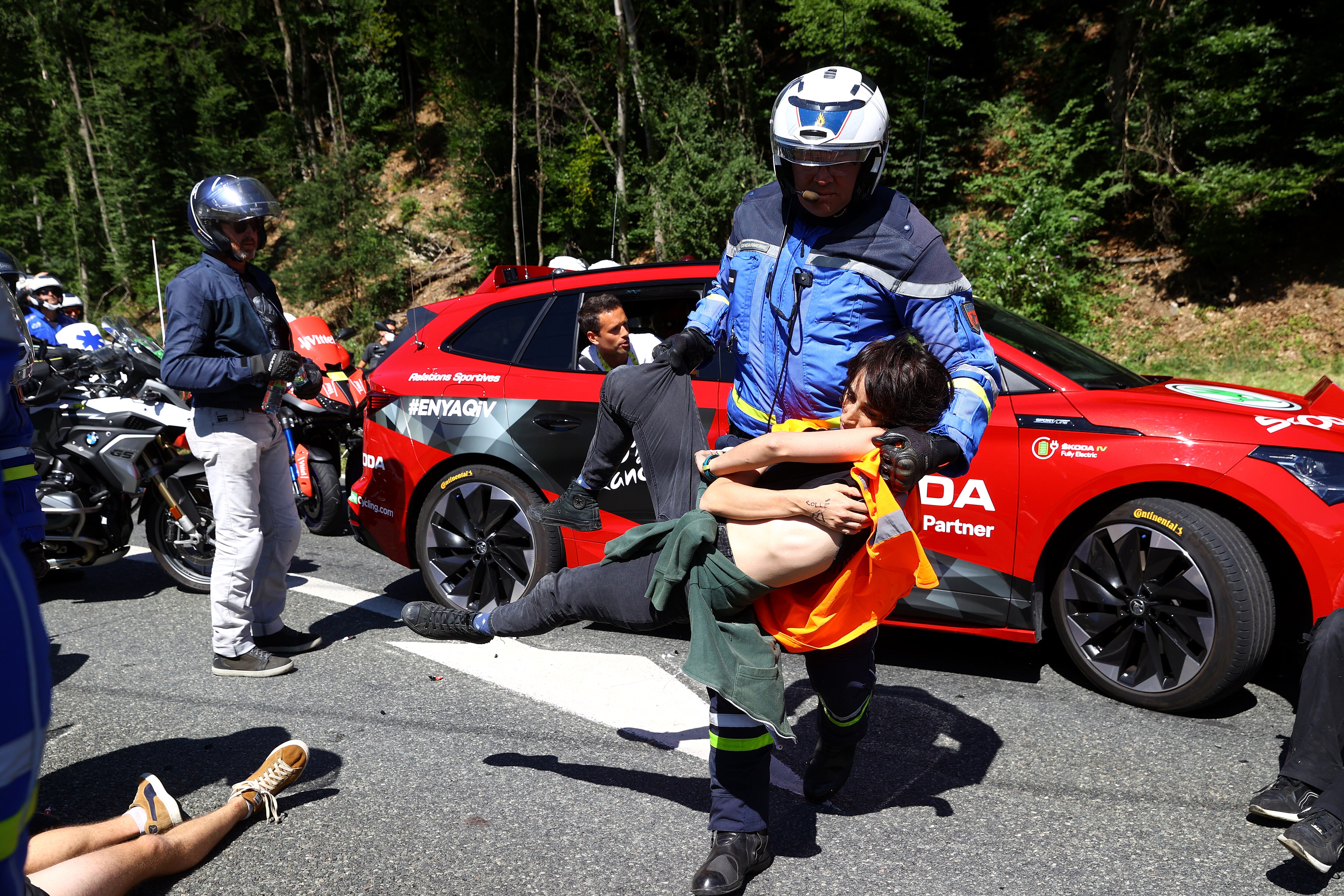 MEGEVE, FRANCE - JULY 12: Protesters in defending "Mont Blanc environment" block the route during the 109th Tour de France 2022, Stage 10 a 148,1km stage from Morzine to Megève 1435m / #TDF2022 / #WorldTour / on July 12, 2022 in Megeve, France. (Photo by Michael Steele/Getty Images)