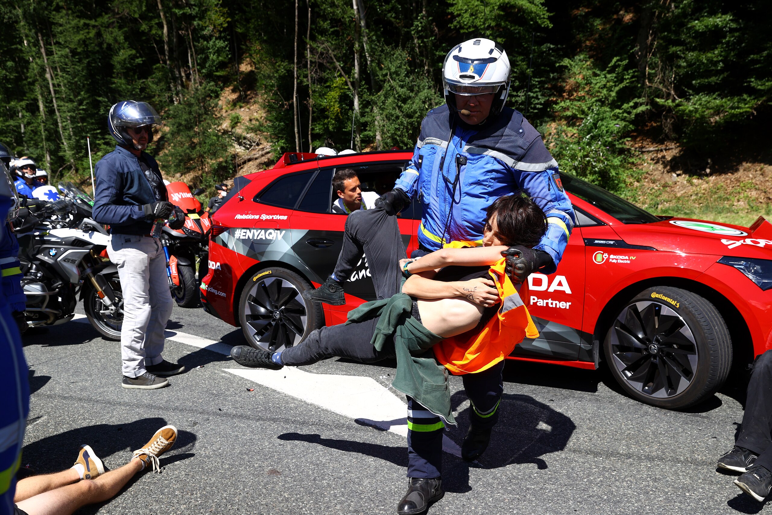MEGEVE, FRANCE - JULY 12: Protesters in defending "Mont Blanc environment" block the route during the 109th Tour de France 2022, Stage 10 a 148,1km stage from Morzine to Megève 1435m / #TDF2022 / #WorldTour / on July 12, 2022 in Megeve, France. (Photo by Michael Steele/Getty Images)