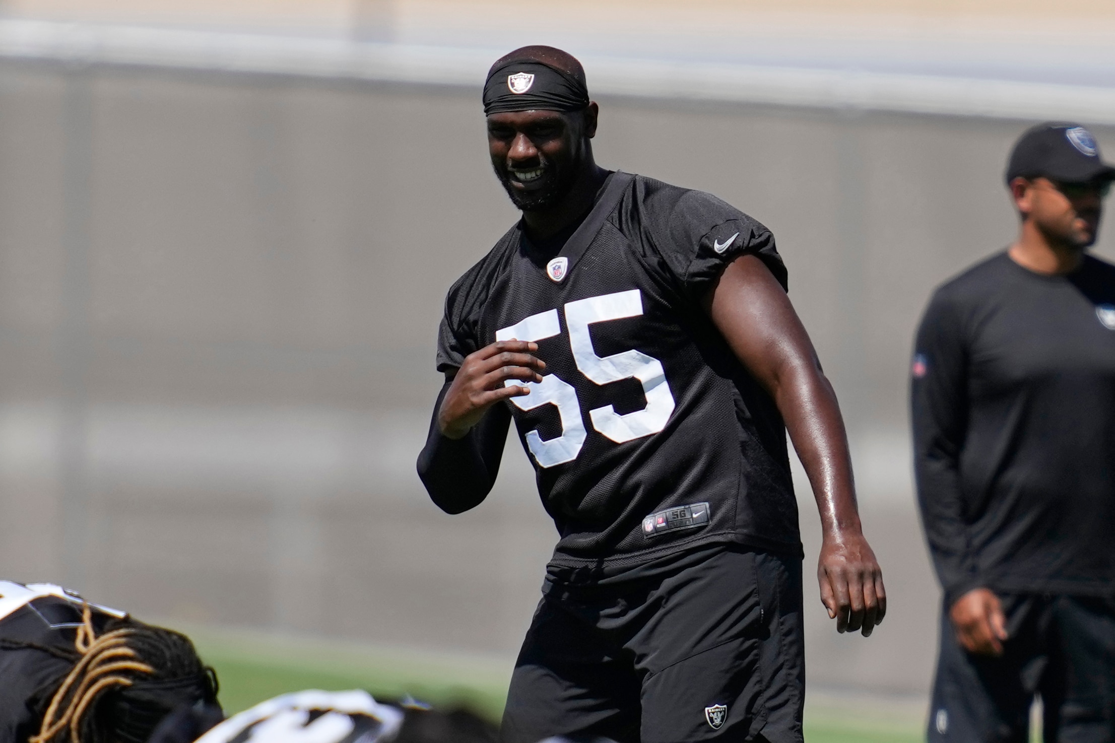 Las Vegas Raiders defensive end Chandler Jones warms up at the NFL football team's practice facility Tuesday, June 7, 2022, in Henderson, Nev. (AP Photo/John Locher)