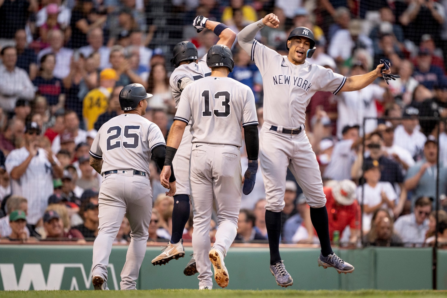 BOSTON, MA - JULY 7: Josh Donaldson #28 of the New York Yankees celebrates his grand slam with Giancarlo Stanton #27 in the third inning against the Boston Red Sox on July 7, 2022 at Fenway Park  in Boston, Massachusetts. (Photo by Maddie Malhotra/Boston Red Sox/Getty Images)