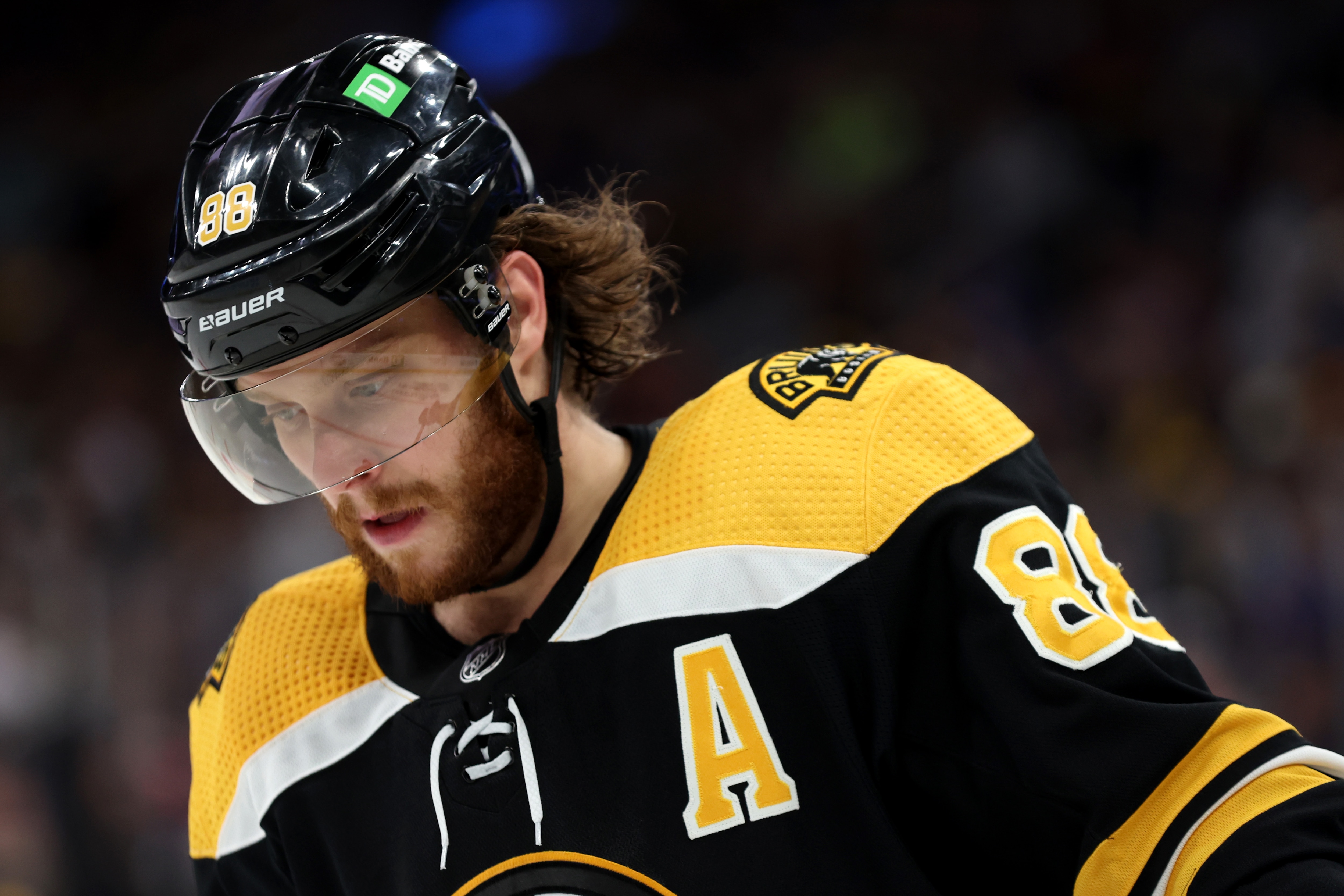 BOSTON, MASSACHUSETTS - APRIL 23: David Pastrnak #88 of the Boston Bruins looks on during the third period against the New York Rangers at TD Garden on April 23, 2022 in Boston, Massachusetts. The Bruins defeat the Rangers 3-1.  (Photo by Maddie Meyer/Getty Images)