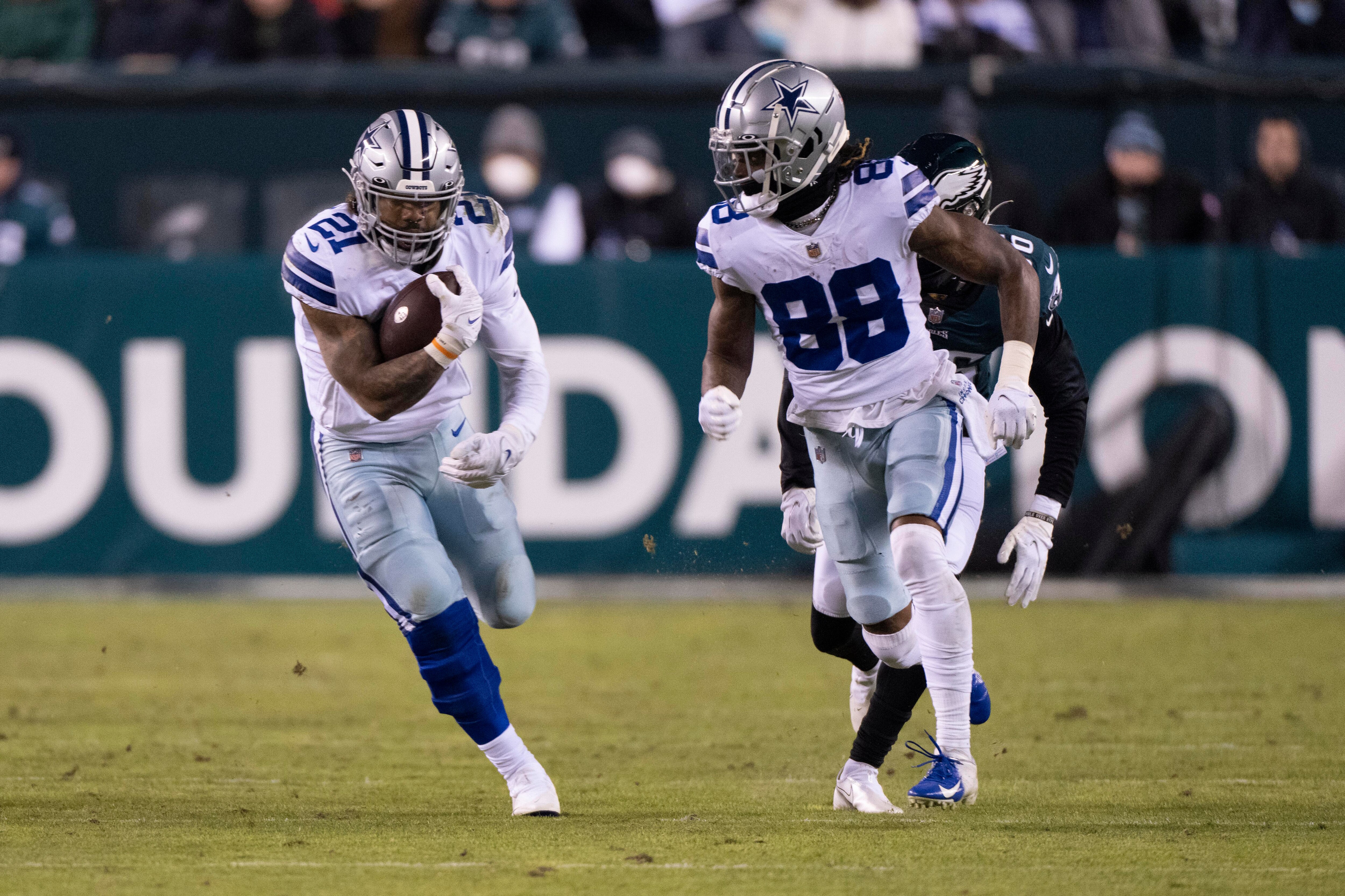 PHILADELPHIA, PA - JANUARY 08: Dallas Cowboys Running Back Ezekiel Elliott (21) runs with the ball with Dallas Cowboys Wide Receiver CeeDee Lamb (88) looking to block during the first half of the National Football League game between the Dallas Cowboys and the Philadelphia Eagles on January 8, 2021, at Lincoln Financial Field in Philadelphia, PA. (Photo by Gregory Fisher/Icon Sportswire via Getty Images)