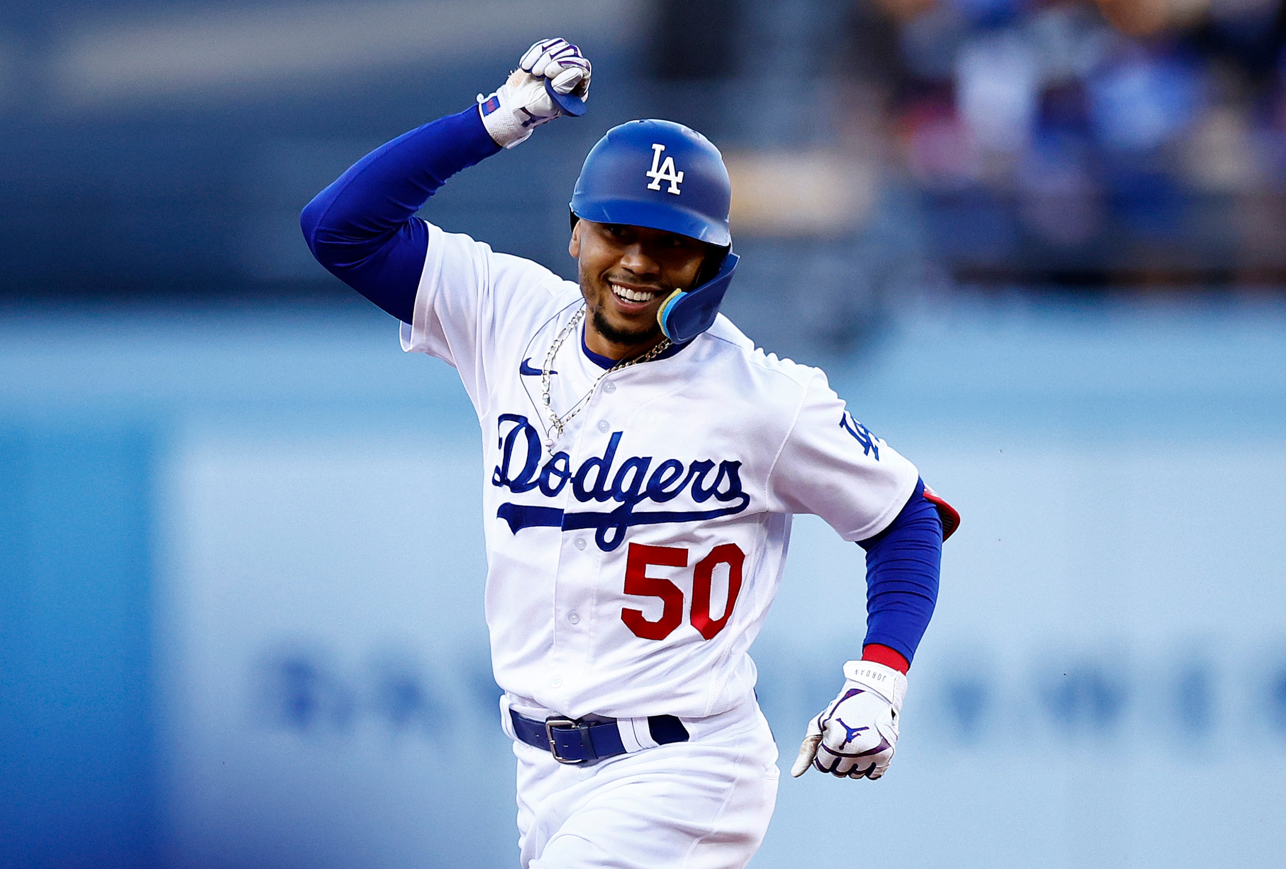 LOS ANGELES, CALIFORNIA - JULY 07:  Mookie Betts #50 of the Los Angeles Dodgers celebrates a home run against the Chicago Cubs in the first inning at Dodger Stadium on July 07, 2022 in Los Angeles, California. (Photo by Ronald Martinez/Getty Images)