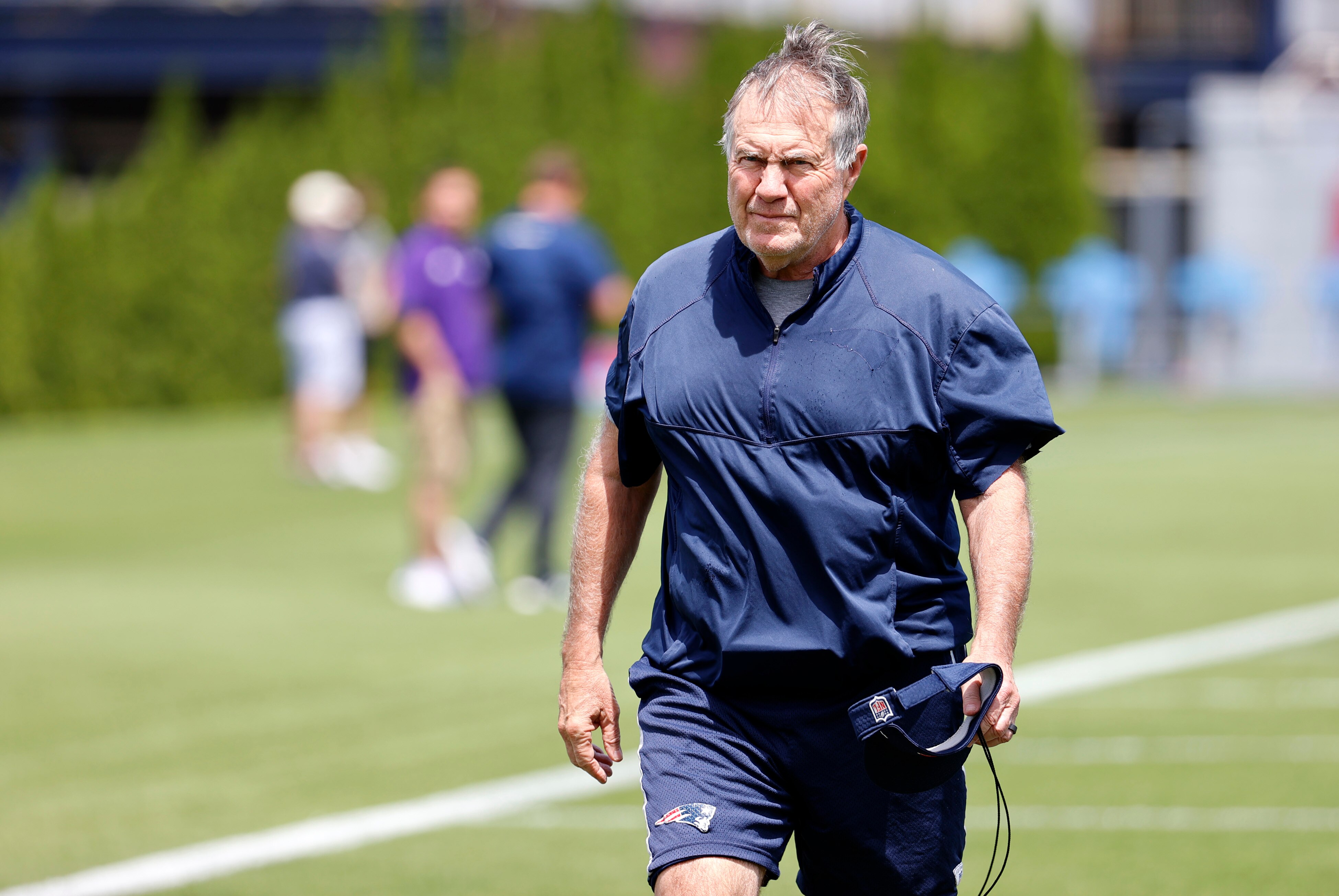 FOXBOROUGH, MA - JUNE 07: New England Patriots head coach Bill Belichick walks to his coaches interview during Day 1 of New England Patriots minicamp on June 7, 2022 at the Patriots Training Facility at Gillette Stadium in Foxborough, Massachusetts. (Photo by Fred Kfoury III/Icon Sportswire via Getty Images)
