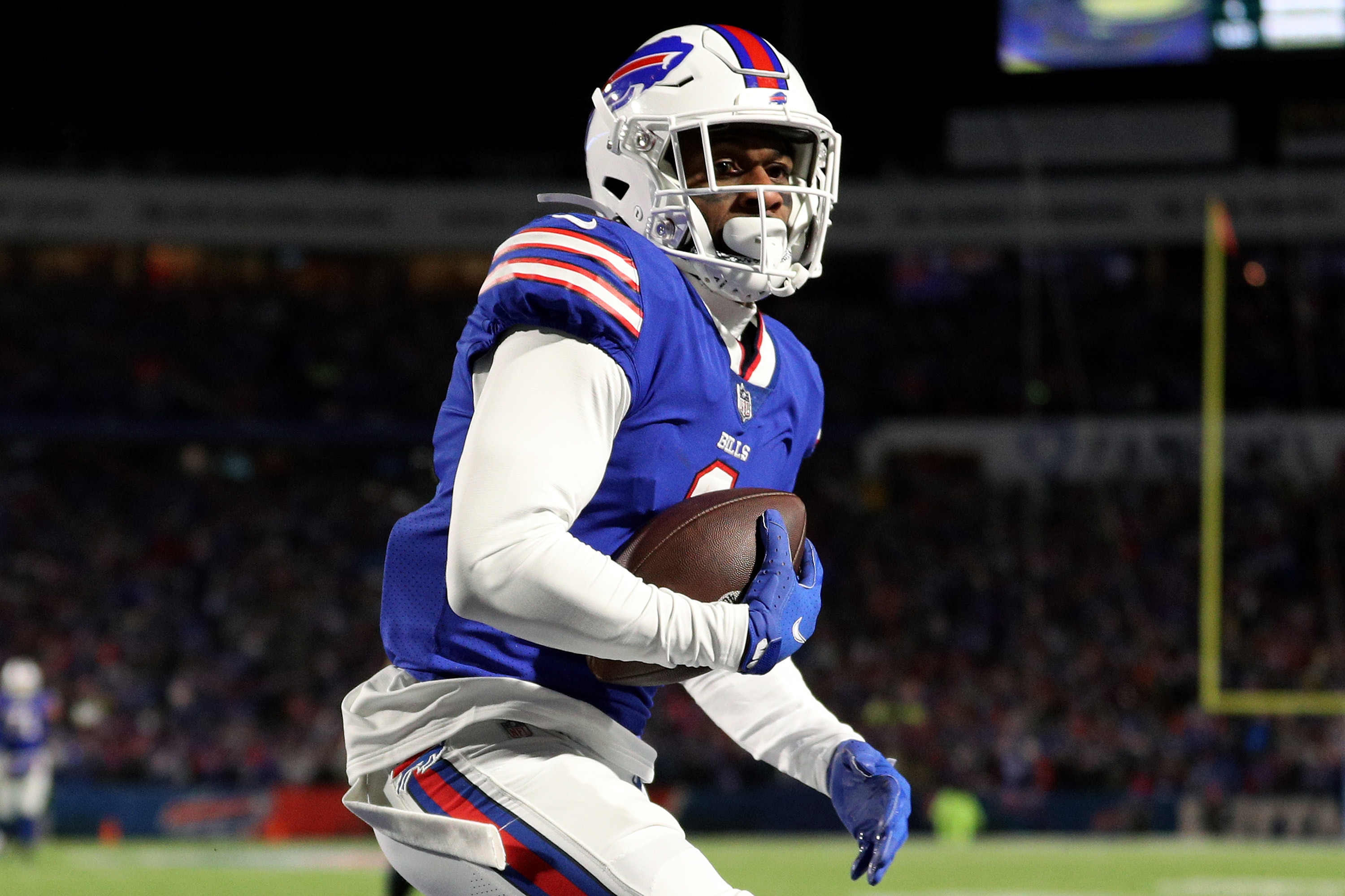BUFFALO, NEW YORK - JANUARY 15: Emmanuel Sanders #1 of the Buffalo Bills scores a touchdown against Joejuan Williams #33 of the New England Patriots during the third quarter in the AFC Wild Card playoff game at Highmark Stadium on January 15, 2022 in Buffalo, New York. (Photo by Bryan M. Bennett/Getty Images)