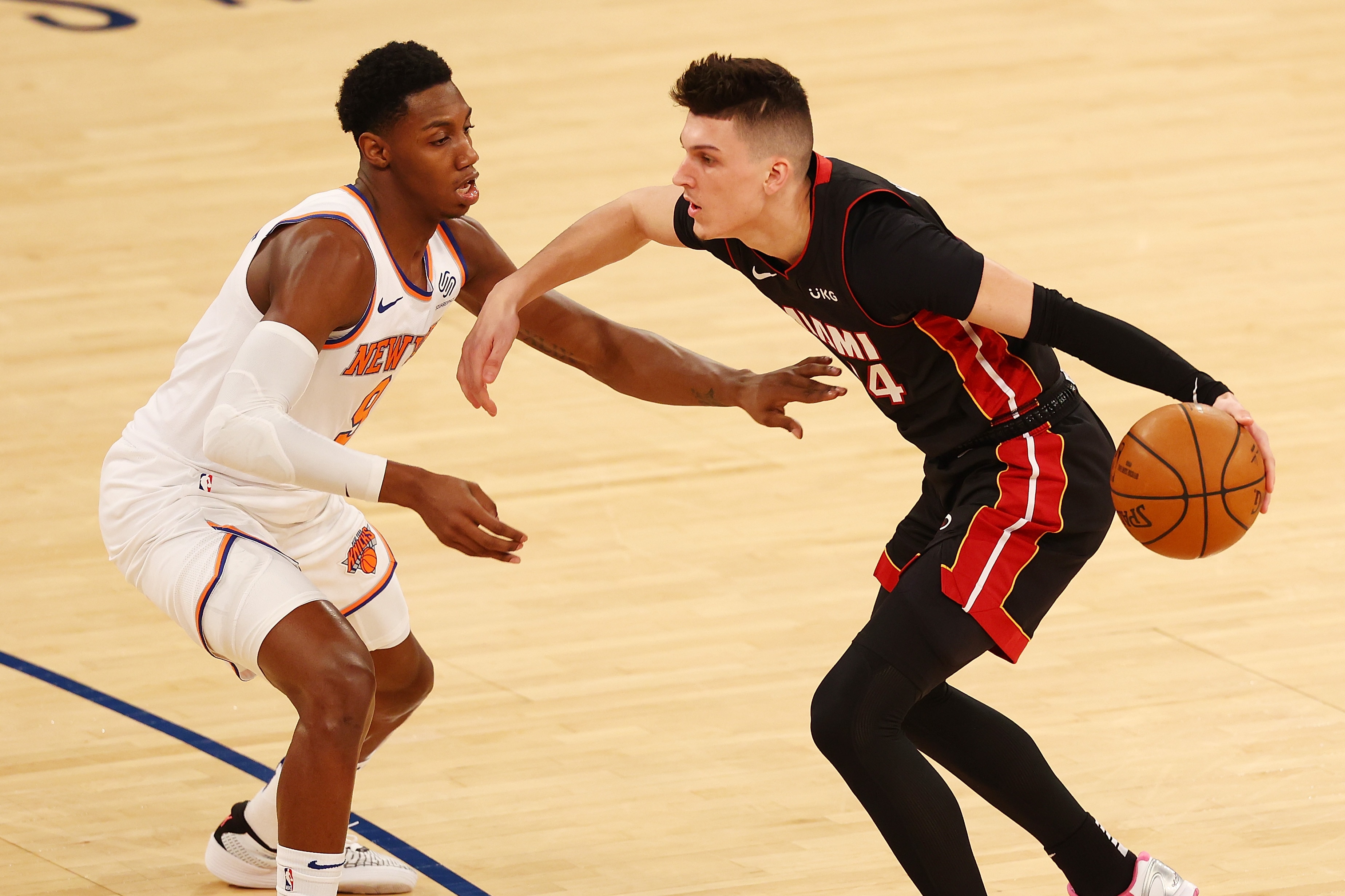 NEW YORK, NEW YORK - MARCH 29: Tyler Herro #14 of the Miami Heat in action against RJ Barrett #9 of the New York Knicksat Madison Square Garden on March 29, 2021 in New York City. NOTE TO USER: User expressly acknowledges and agrees that, by downloading and or using this photograph, User is consenting to the terms and conditions of the Getty Images License Agreement. Miami Heat defeated the New York Knicks 98-88. (Photo by Mike Stobe/Getty Images)