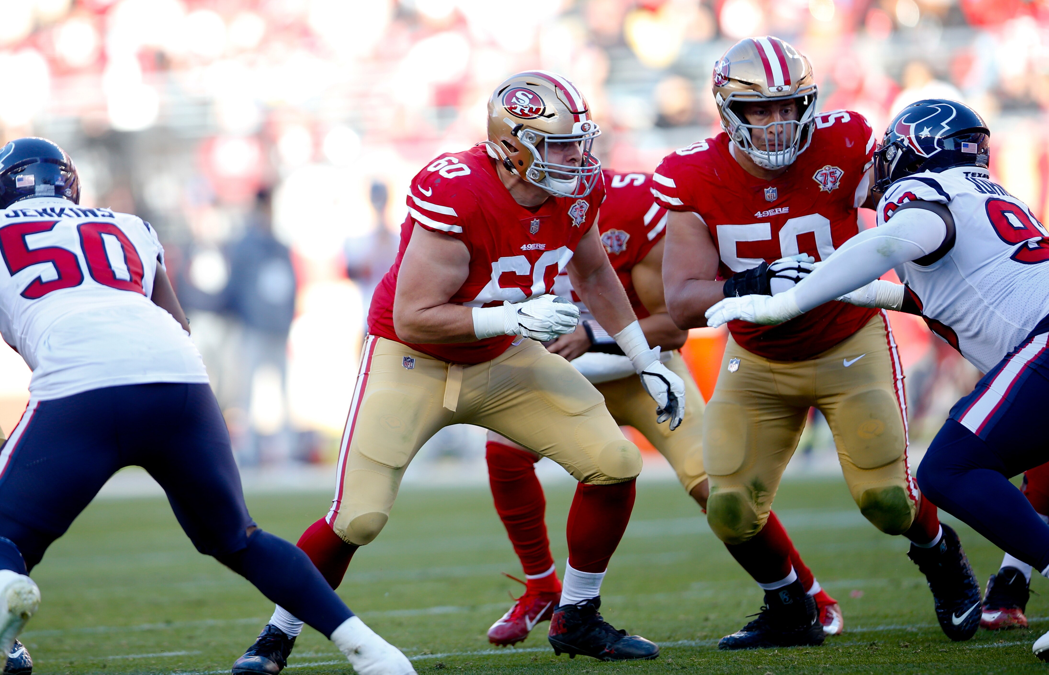 SANTA CLARA, CA - JANUARY 2: Daniel Brunskill #60 and Alex Mack #50 of the San Francisco 49ers block during the game against the Houston Texans at Levi's Stadium on January 2, 2022 in Santa Clara, California. The 49ers defeated the Texans 23-7. (Photo by Michael Zagaris/San Francisco 49ers/Getty Images)