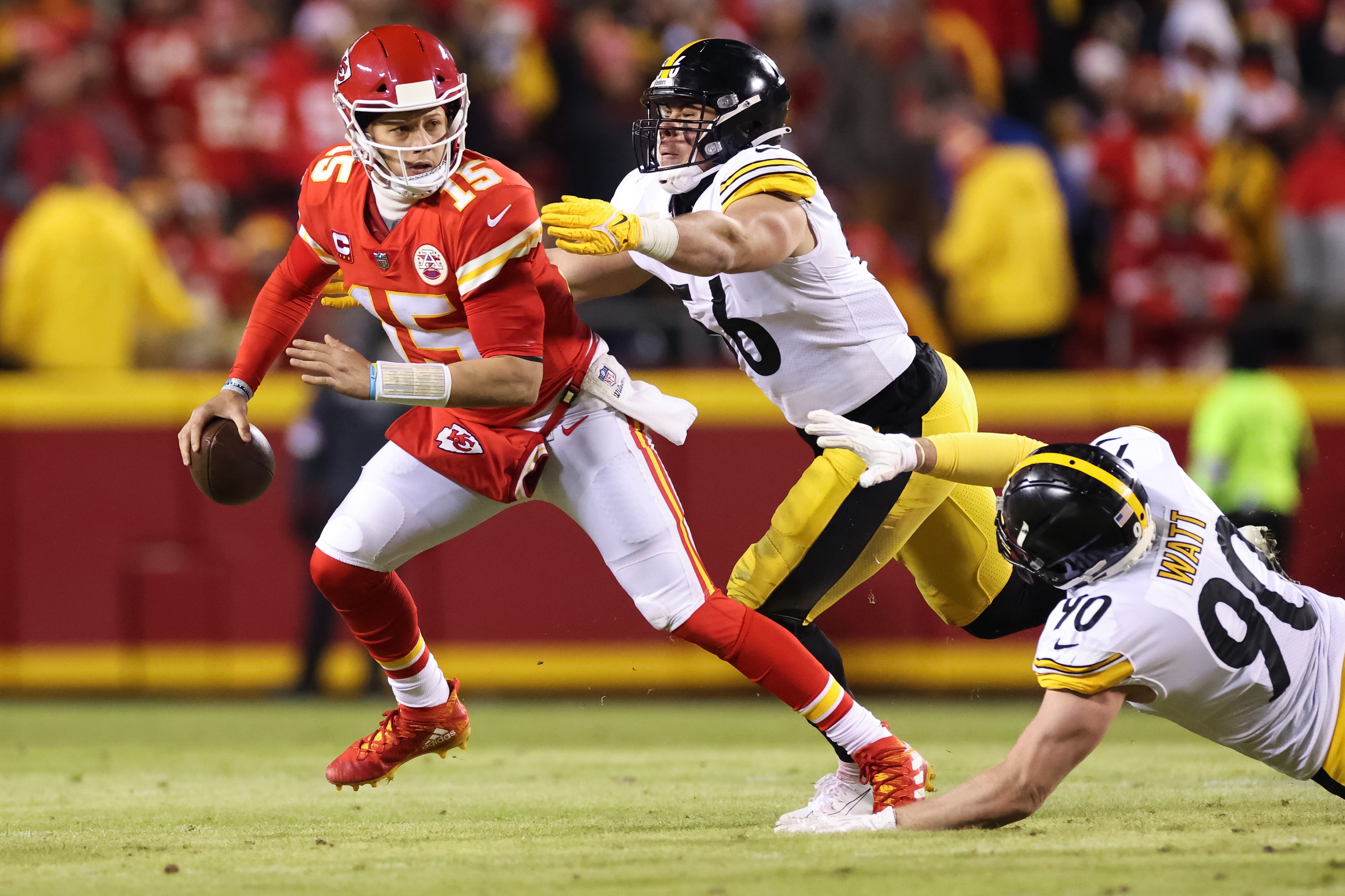 KANSAS CITY, MISSOURI - JANUARY 16: Patrick Mahomes #15 of the Kansas City Chiefs is sacked by Alex Highsmith #56 of the Pittsburgh Steelers in the second quarter in the NFC Wild Card Playoff game at Arrowhead Stadium on January 16, 2022 in Kansas City, Missouri. (Photo by David Eulitt/Getty Images)