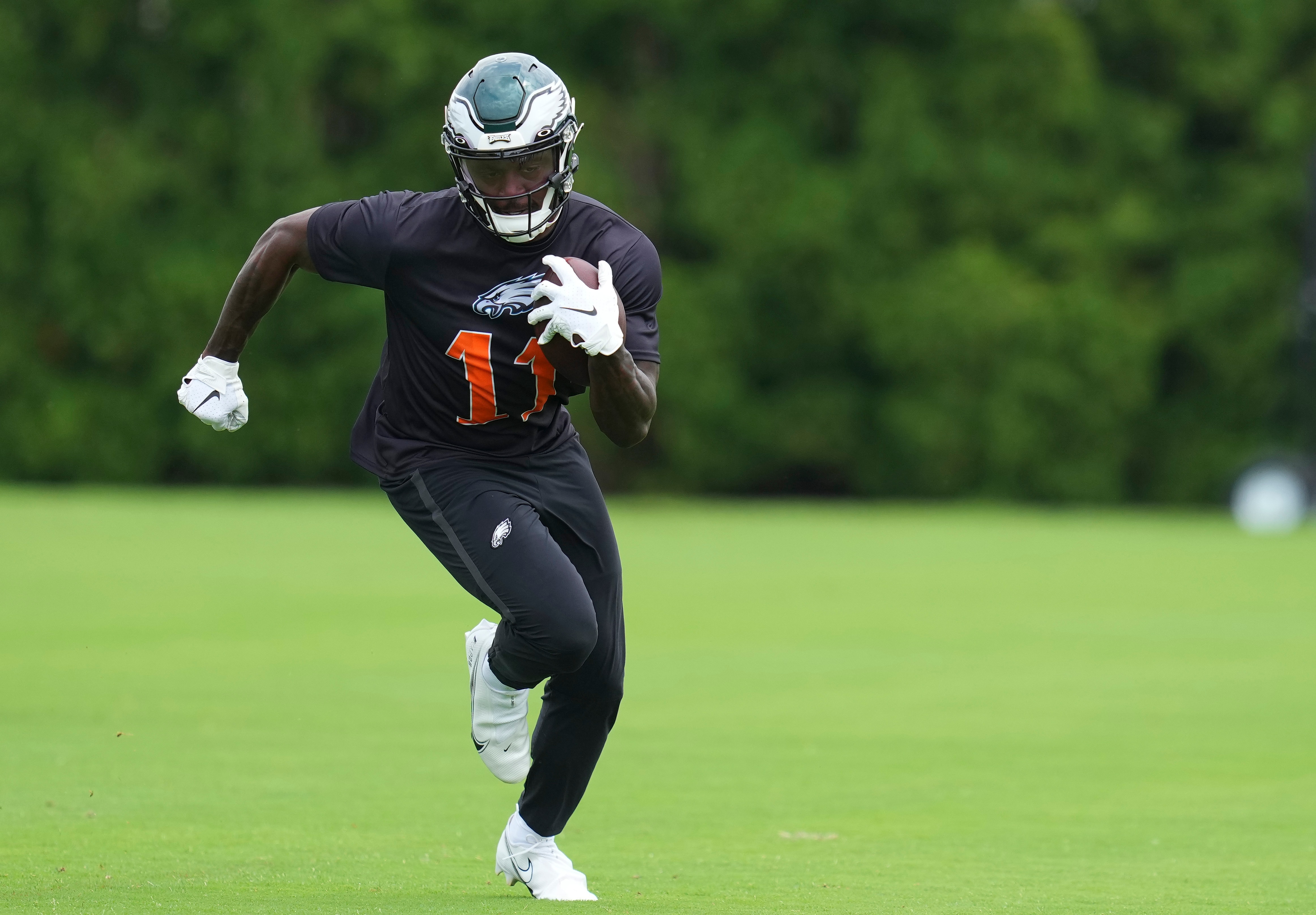 PHILADELPHIA, PA - JUNE 03: A.J. Brown #11 of the Philadelphia Eagles runs with the ball during OTAs at the NovaCare Complex on June 3, 2022 in Philadelphia, Pennsylvania. (Photo by Mitchell Leff/Getty Images)
