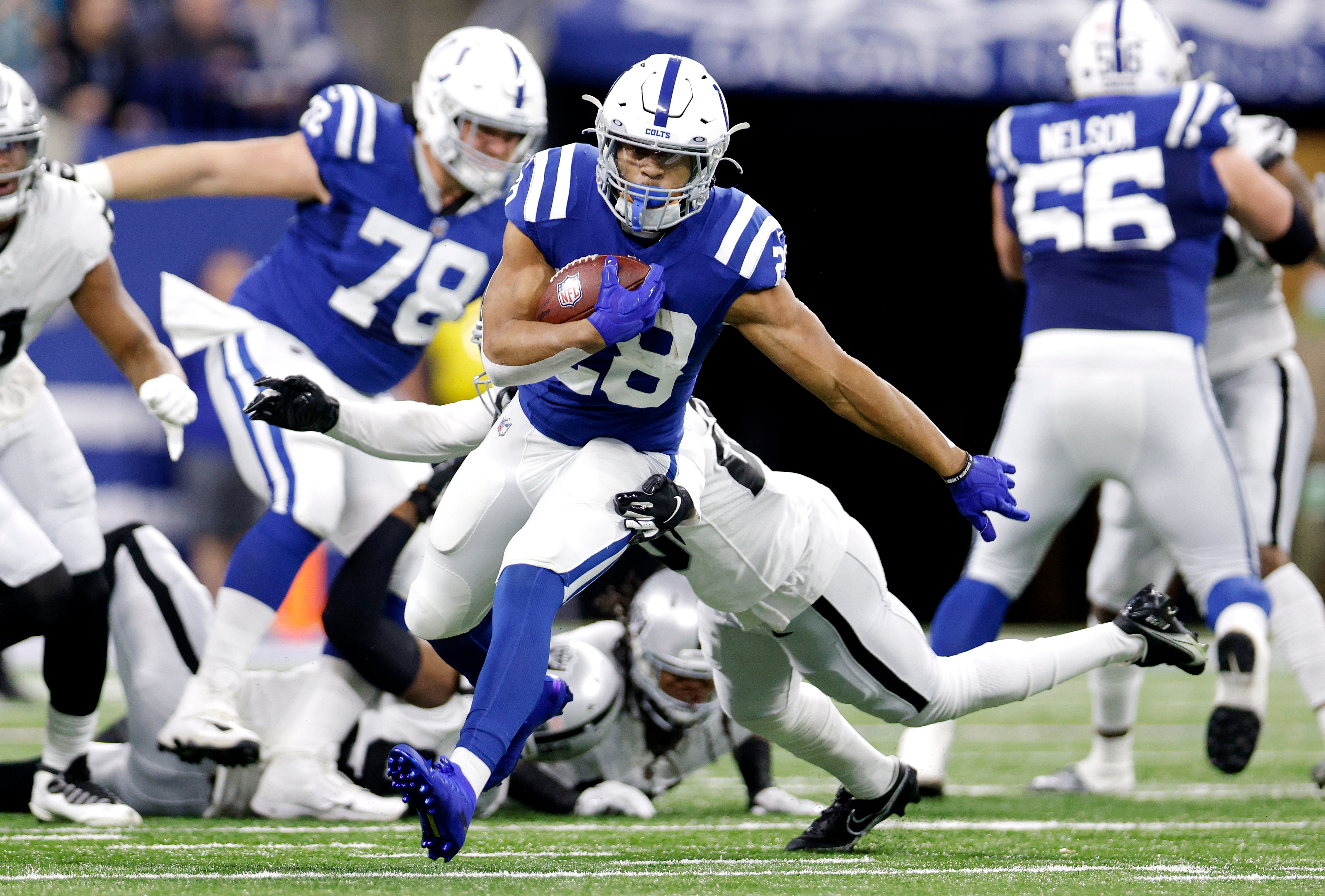 INDIANAPOLIS, INDIANA - JANUARY 02: Jonathan Taylor #28 of the Indianapolis Colts carries the ball during the first half against the Las Vegas Raiders at Lucas Oil Stadium on January 02, 2022 in Indianapolis, Indiana. (Photo by Michael Hickey/Getty Images)