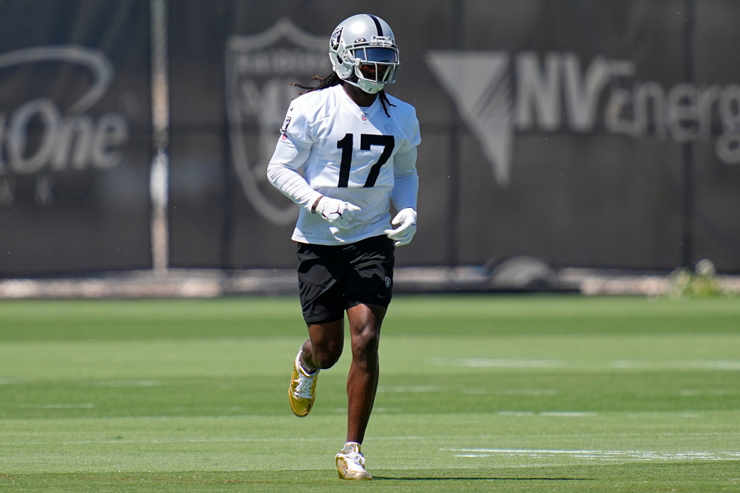 Las Vegas Raiders wide receiver Davante Adams warms up at the NFL football team's practice facility Wednesday, June 8, 2022, in Henderson, Nev. (AP Photo/John Locher)