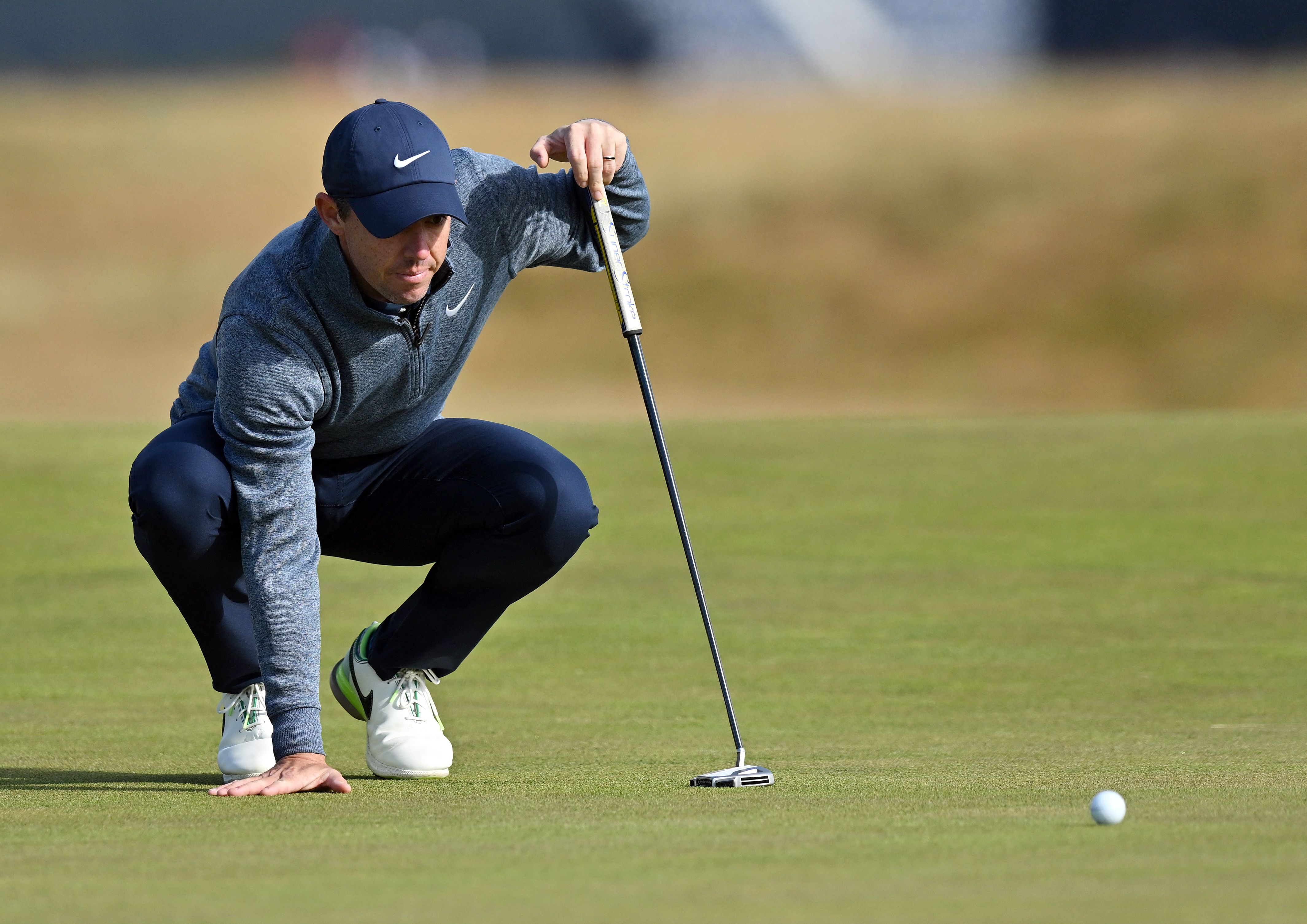 Northern Ireland's Rory McIlroy lines up a putt on the 17th green during a practice round for The 150th British Open Golf Championship on The Old Course at St Andrews in Scotland on July 13, 2022. - RESTRICTED TO EDITORIAL USE (Photo by Glyn KIRK / AFP) / RESTRICTED TO EDITORIAL USE (Photo by GLYN KIRK/AFP via Getty Images)
