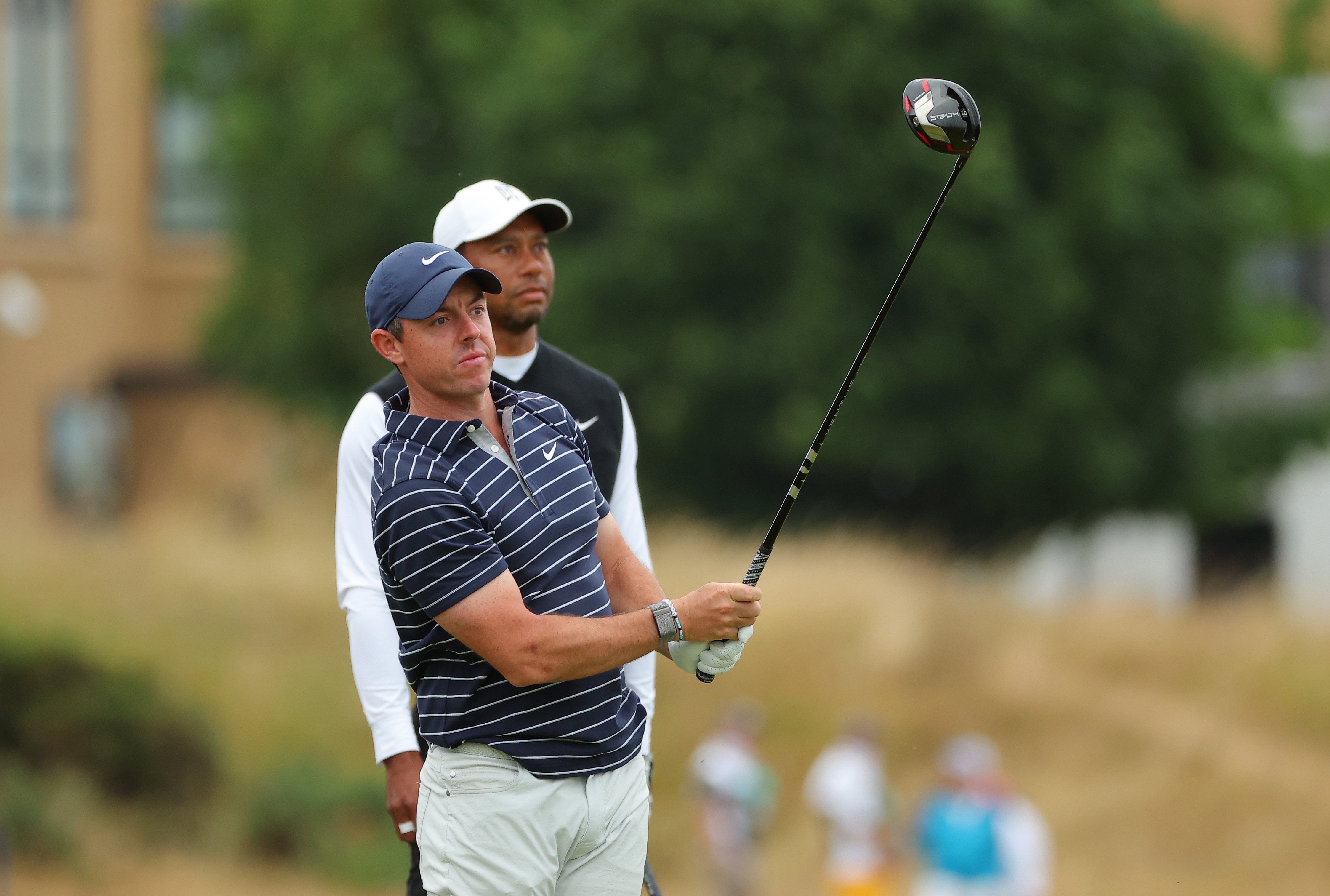 ST ANDREWS, SCOTLAND - JULY 11: Tiger Woods of The United States and Rory McIlroy of Northern Ireland interact on the 18th during the Celebration of Champions Challenge during a practice round prior to The 150th Open at St Andrews Old Course on July 11, 2022 in St Andrews, Scotland. (Photo by Kevin C. Cox/Getty Images)