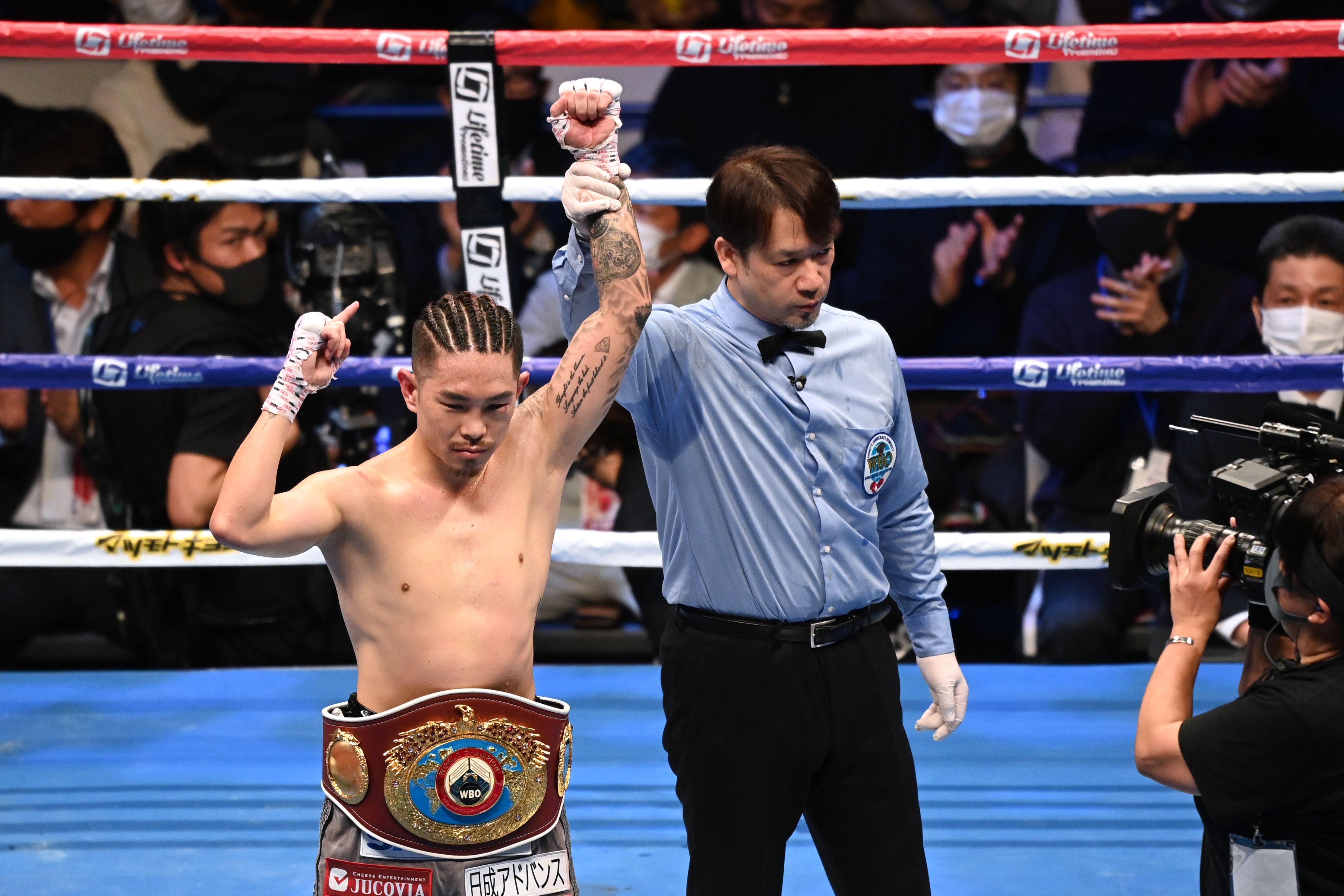 Kazuto Ioka of Japan celebrates his win over compatriot Kosei Tanaka during their WBO men's super flyweight title bout at Ota City General Gymnasium in Tokyo on December 31, 2020. (Photo by Kazuhiro NOGI / AFP) (Photo by KAZUHIRO NOGI/AFP via Getty Images)