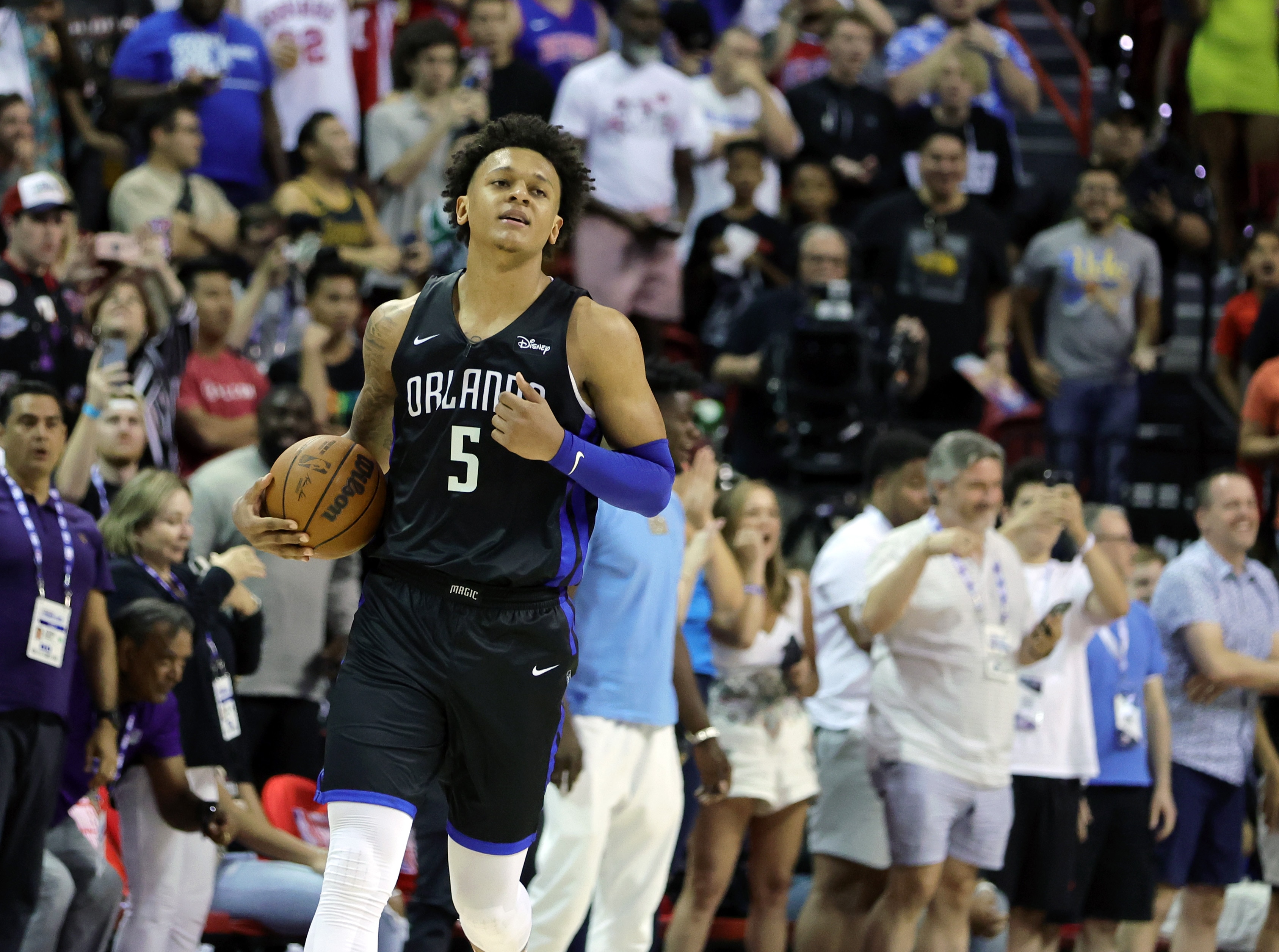 LAS VEGAS, NEVADA - JULY 09: Paolo Banchero #5 of the Orlando Magic reacts after being called for a foul after blocking an alley-oop dunk attempt by Neemias Queta #88 of the Sacramento Kings that would have won the game in sudden-death overtime for the Kings during the 2022 NBA Summer League at the Thomas & Mack Center on July 09, 2022 in Las Vegas, Nevada. The Magic successfully challenged the foul call. NOTE TO USER: User expressly acknowledges and agrees that, by downloading and or using this photograph, User is consenting to the terms and conditions of the Getty Images License Agreement. (Photo by Ethan Miller/Getty Images)