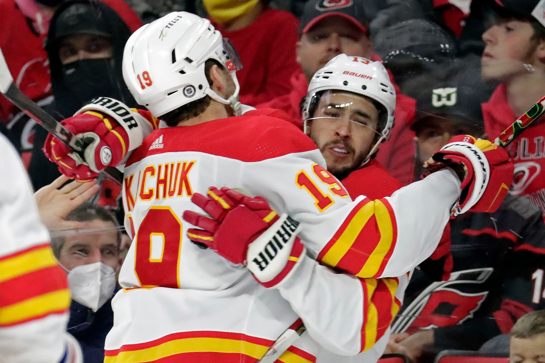 Calgary Flames left wing Johnny Gaudreau, right, celebrates his goal with left wing Matthew Tkachuk (19) during the third period of an NHL hockey game against the Carolina Hurricanes, Friday, Jan. 7, 2022, in Raleigh, N.C. (AP Photo/Chris Seward)