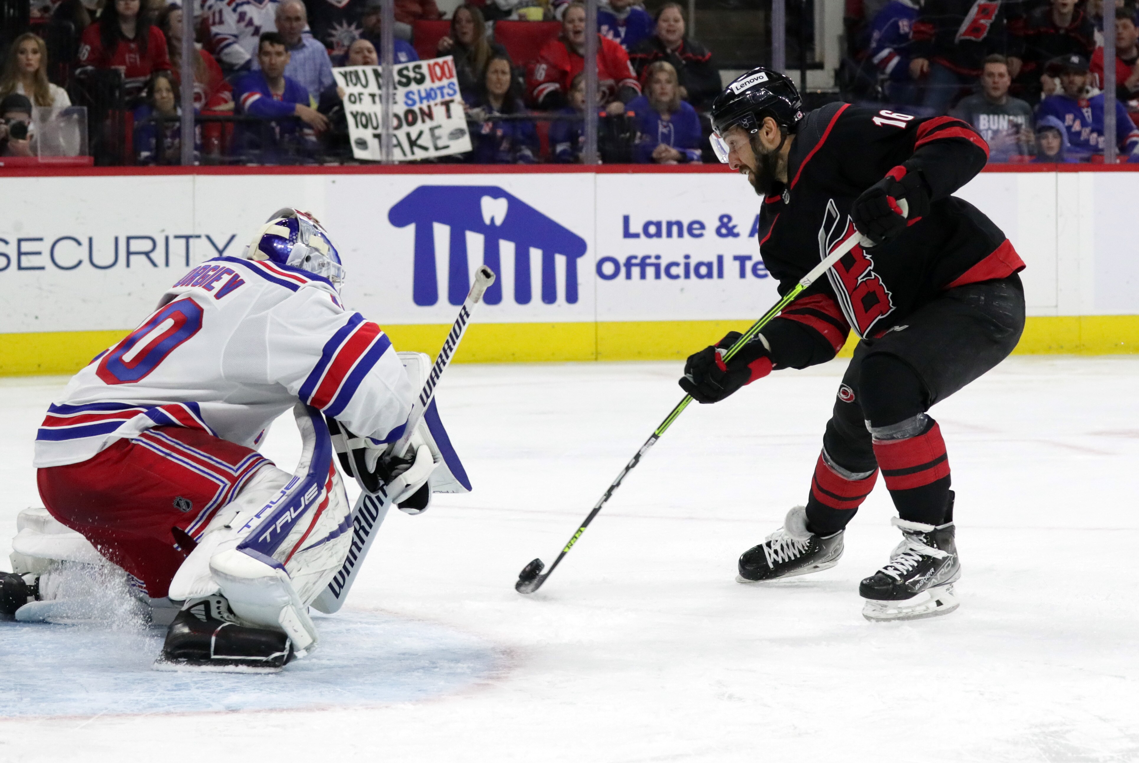 RALEIGH, NC - MARCH 20: Goaltender Alexandar Georgiev #40 of the New York Rangers crouches in the crease to make the save as Vincent Trocheck #16 shoots the puck during an NHL game on March 20, 2022 at PNC Arena in Raleigh, North Carolina. (Photo by Gregg Forwerck/NHLI via Getty Images)