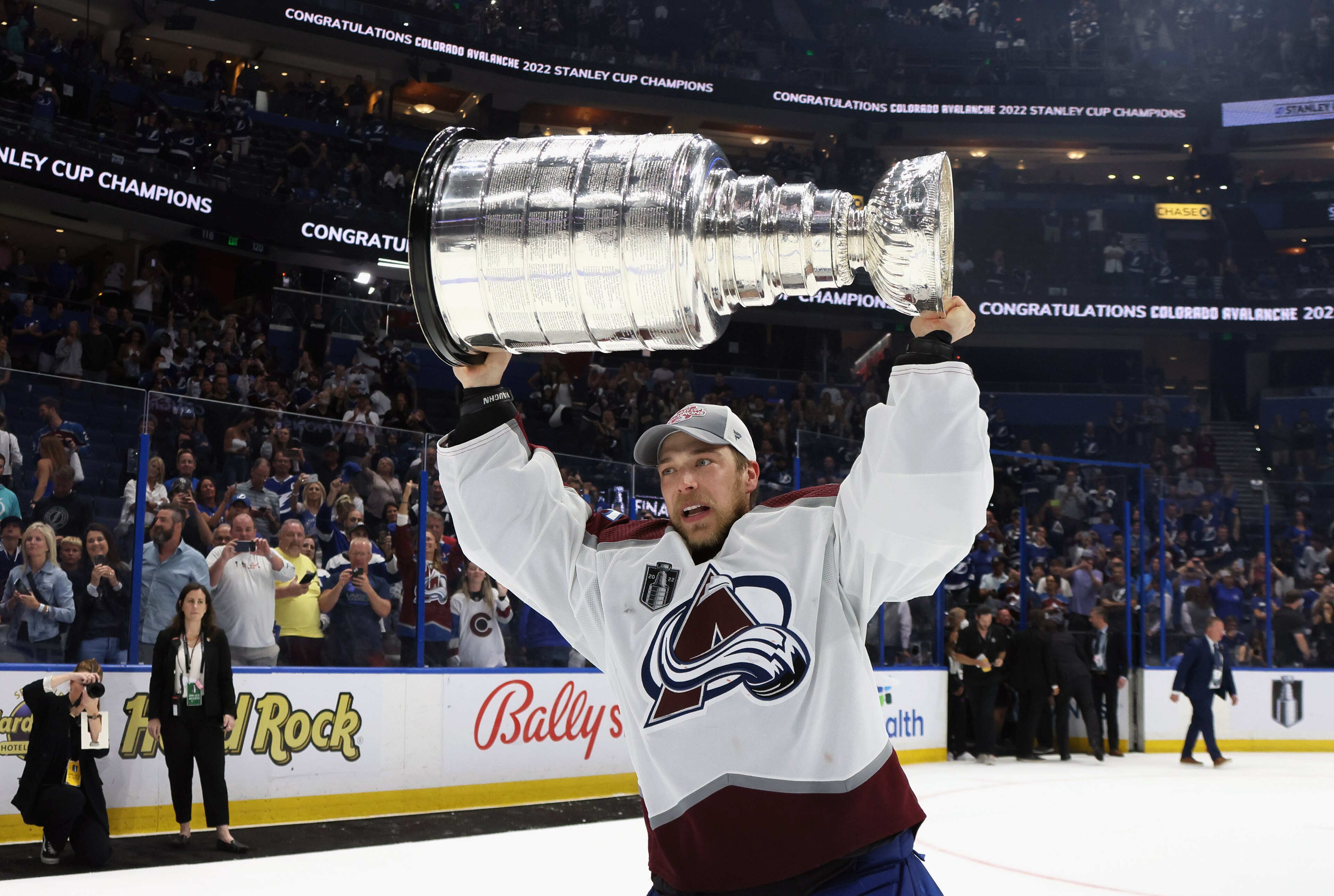 TAMPA, FLORIDA - JUNE 26: Darcy Kuemper #35 of the Colorado Avalanche carries the Stanley Cup following the series winning victory over the Tampa Bay Lightning in Game Six of the 2022 NHL Stanley Cup Final at Amalie Arena on June 26, 2022 in Tampa, Florida. (Photo by Bruce Bennett/Getty Images) TAMPA, FLORIDA - JUNE 26: Darcy Kuemper #35 of the Colorado Avalanche carries the Stanley Cup following the series winning victory over the Tampa Bay Lightning in Game Six of the 2022 NHL Stanley Cup Final at Amalie Arena on June 26, 2022 in Tampa, Florida. (Photo by Bruce Bennett/Getty Images)