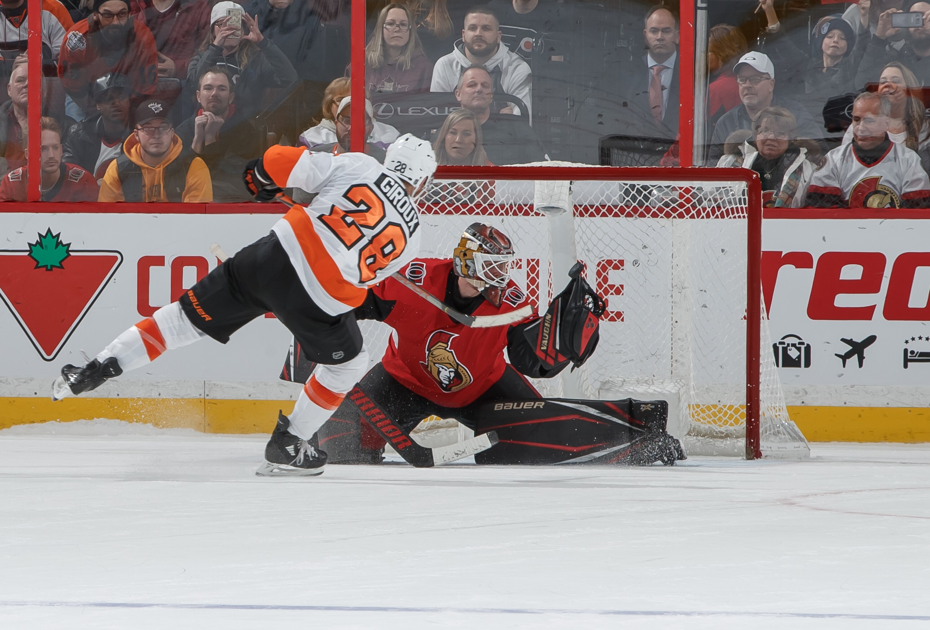 OTTAWA, ON - DECEMBER 21:  Marcus Hogberg #35 of the Ottawa Senators makes a glove save against Claude Giroux #28 of the Philadelphia Flyers on his shootout attempt at Canadian Tire Centre on December 21, 2019 in Ottawa, Ontario, Canada.  (Photo by Andre Ringuette/NHLI via Getty Images)