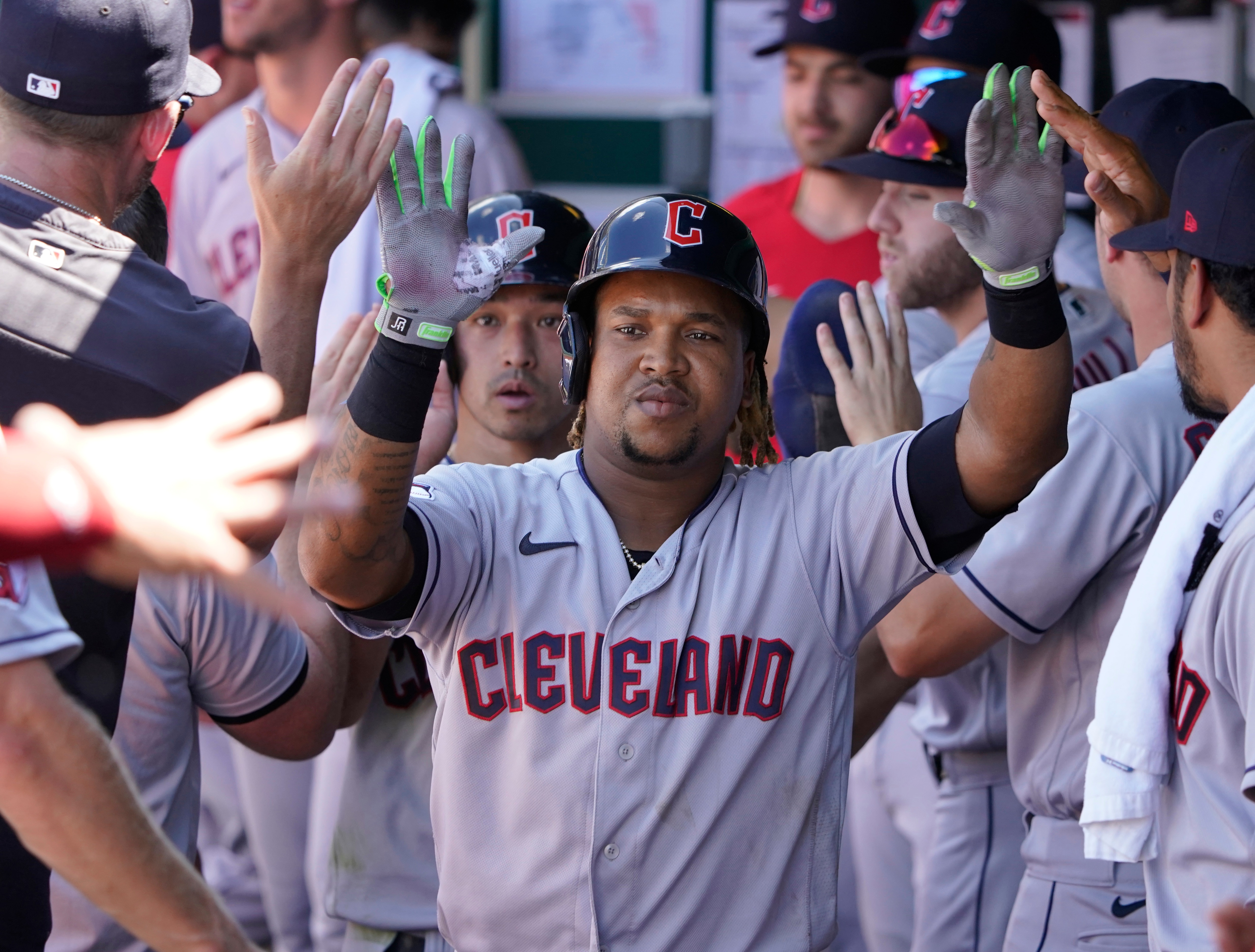 KANSAS CITY, MISSOURI - JULY 09: Jose Ramirez #11 of the Cleveland Guardians is congratulated by teammates after hitting a two-run home run in the second inning against the Kansas City Royals at Kauffman Stadium on July 09, 2022 in Kansas City, Missouri. (Photo by Ed Zurga/Getty Images)