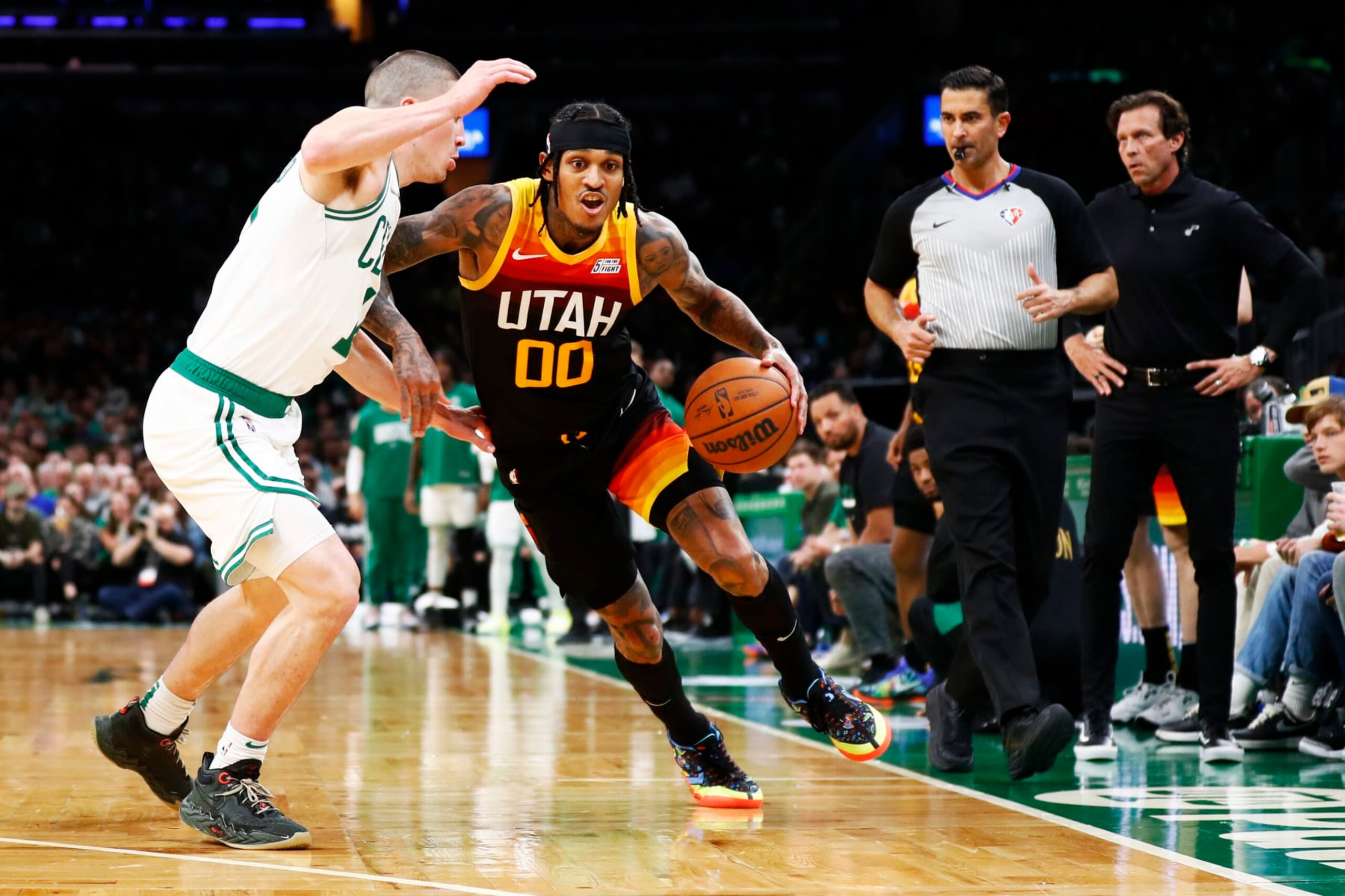 BOSTON, MASSACHUSETTS - MARCH 23: Payton Pritchard #11 of the Boston Celtics defends Jordan Clarkson #00 of the Utah Jazz during the fourth quarter of the game at TD Garden on March 23, 2022 in Boston, Massachusetts. NOTE TO USER: User expressly acknowledges and agrees that, by downloading and or using this photograph, User is consenting to the terms and conditions of the Getty Images License Agreement.  (Photo by Omar Rawlings/Getty Images)