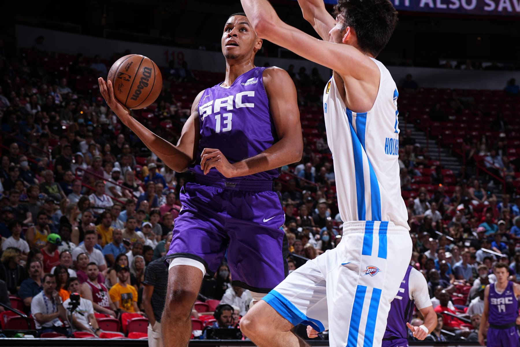 LAS VEGAS, NV - JULY 13: Keegan Murray #13 of the Sacramento Kings drives to the basket during the game against the Oklahoma City Thunder during the 2022 Las Vegas Summer League on July 13, 2022 at the Thomas & Mack Center in Las Vegas, Nevada. NOTE TO USER: User expressly acknowledges and agrees that, by downloading and/or using this Photograph, user is consenting to the terms and conditions of the Getty Images License Agreement. Mandatory Copyright Notice: Copyright 2022 NBAE (Photo by Garrett Ellwood/NBAE via Getty Images)