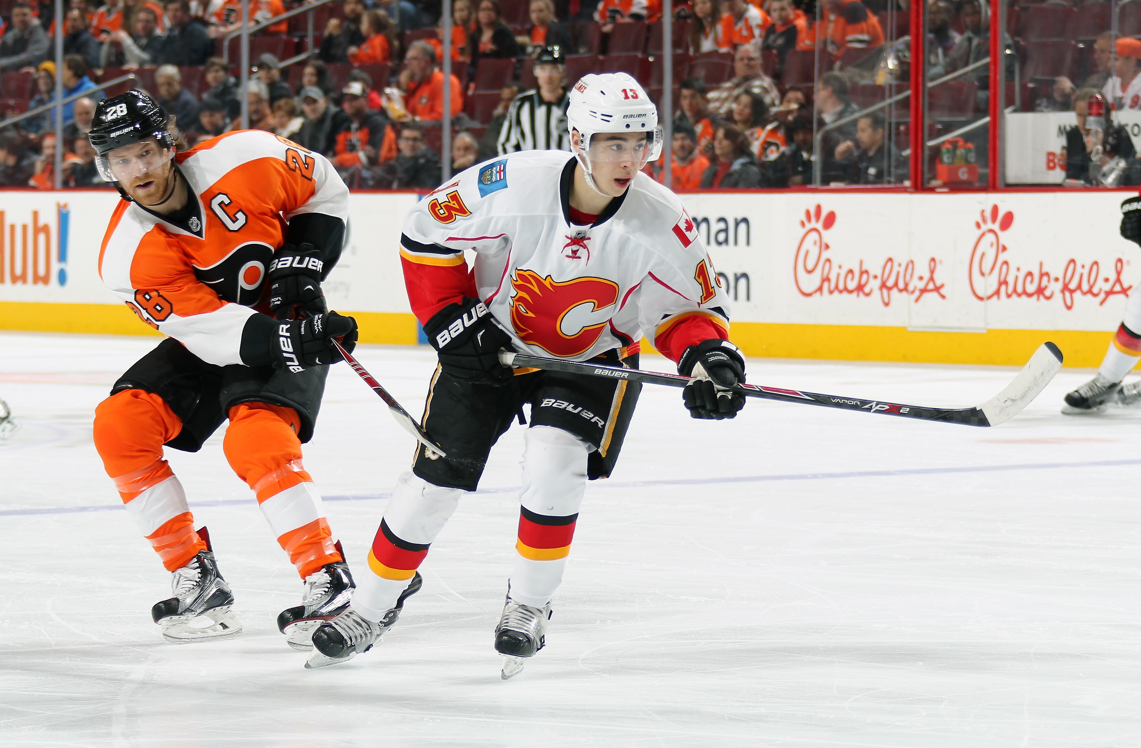 PHILADELPHIA, PA - MARCH 03:  Johnny Gaudreau #13 of the Calgary Flames skates against Claude Giroux #28 of the Philadelphia Flyers on March 3, 2015 at the Wells Fargo Center in Philadelphia, Pennsylvania.  (Photo by Len Redkoles/NHLI via Getty Images)